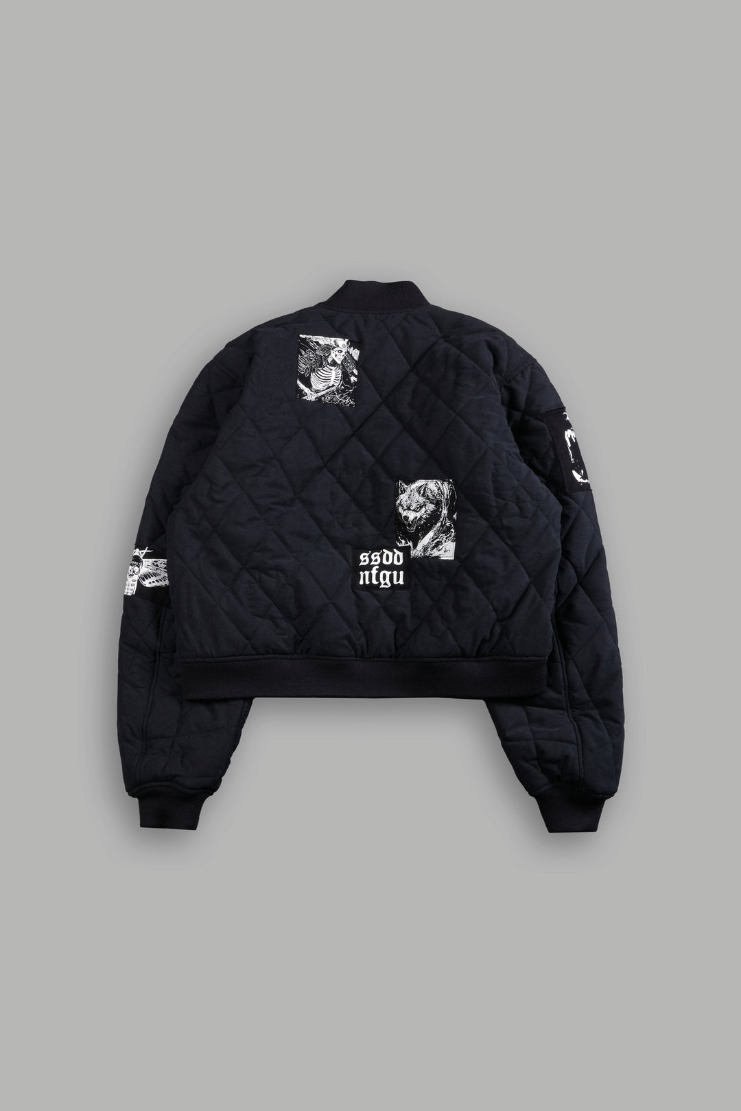 Patched Wolf Hesh Cloud Quilted Reversible Bomber Jacket in Black