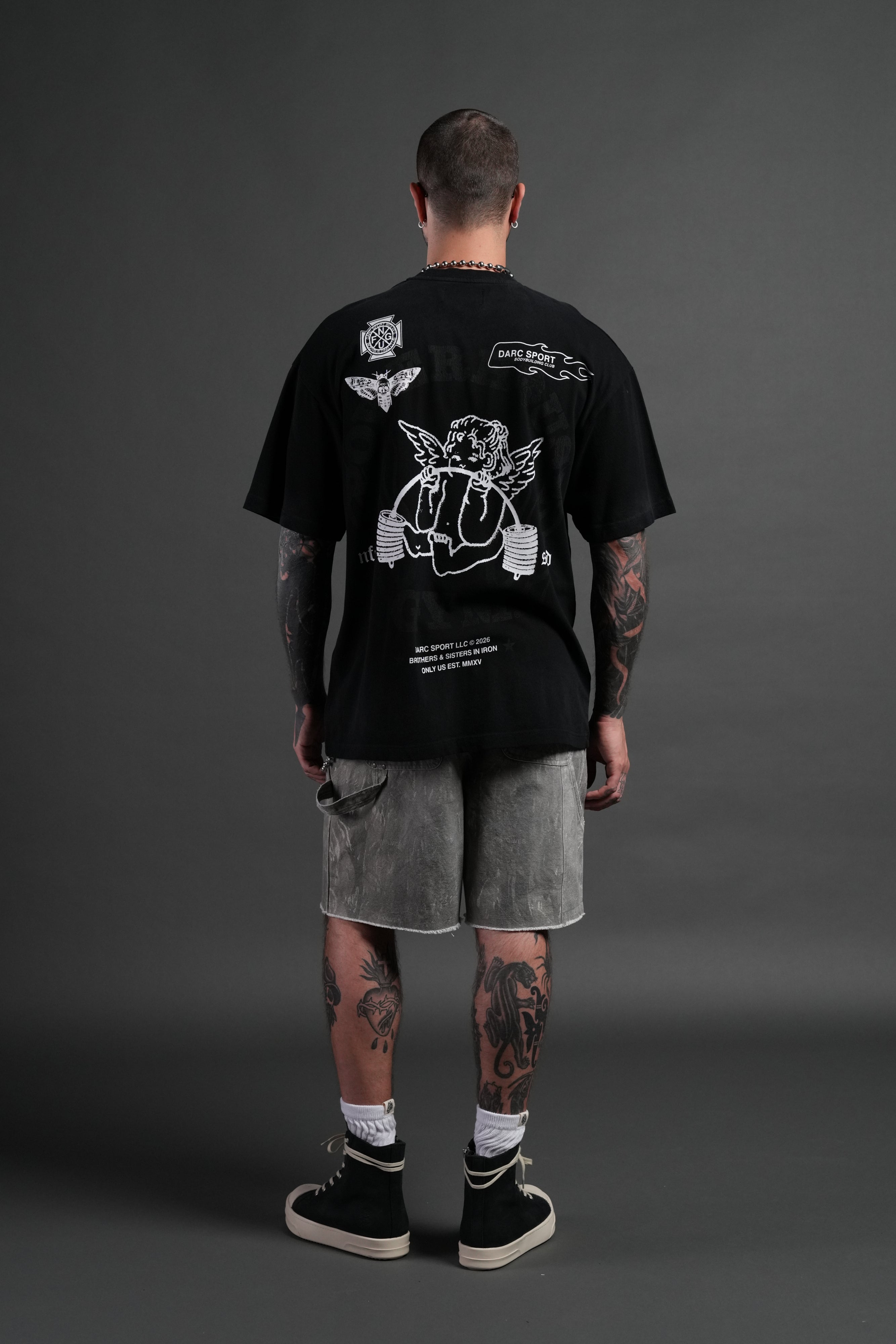 Powerhouse of the Cherub Unisex Premium Oversized Tee in Black Drift Wash