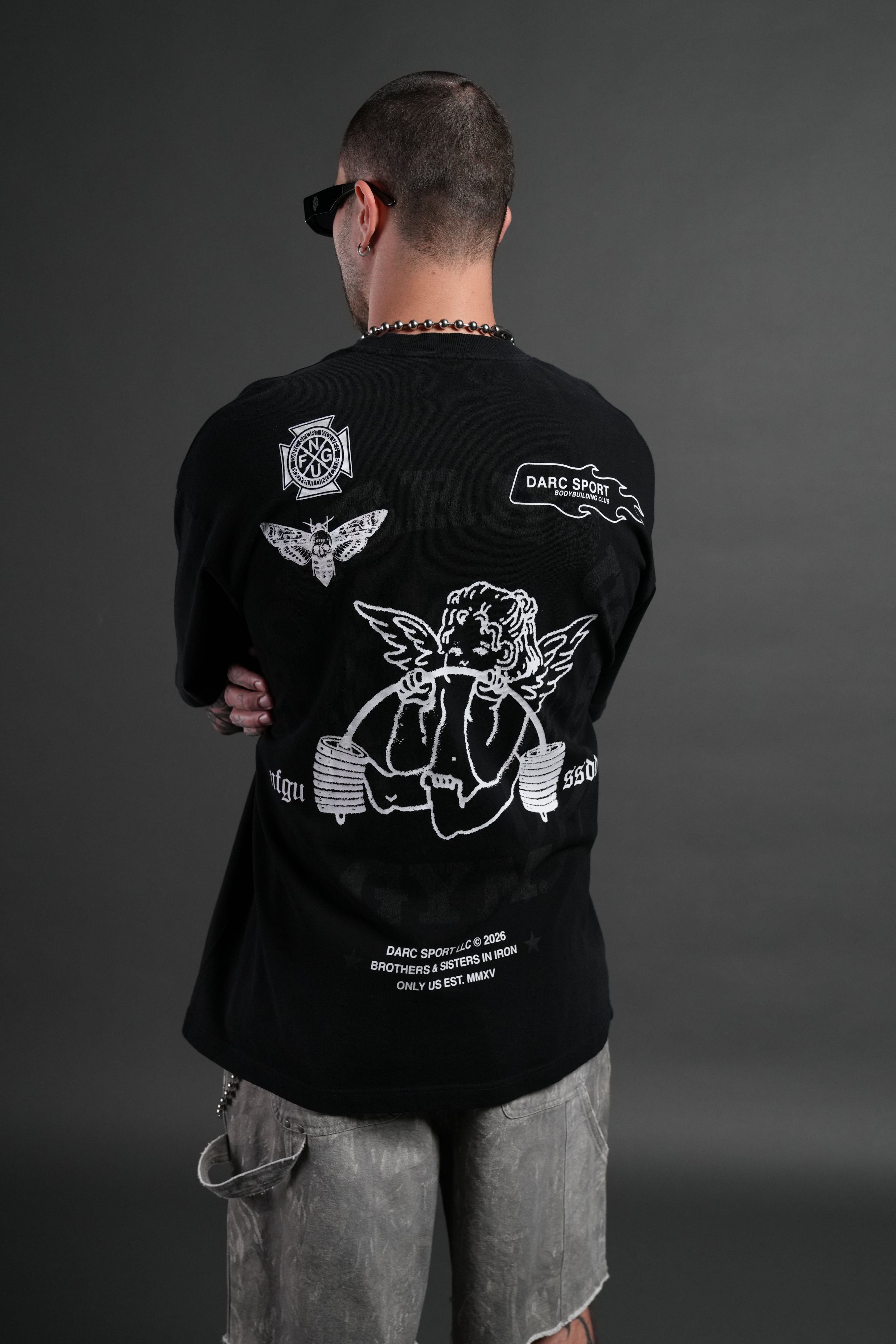 Powerhouse of the Cherub Unisex Premium Oversized Tee in Black Drift Wash