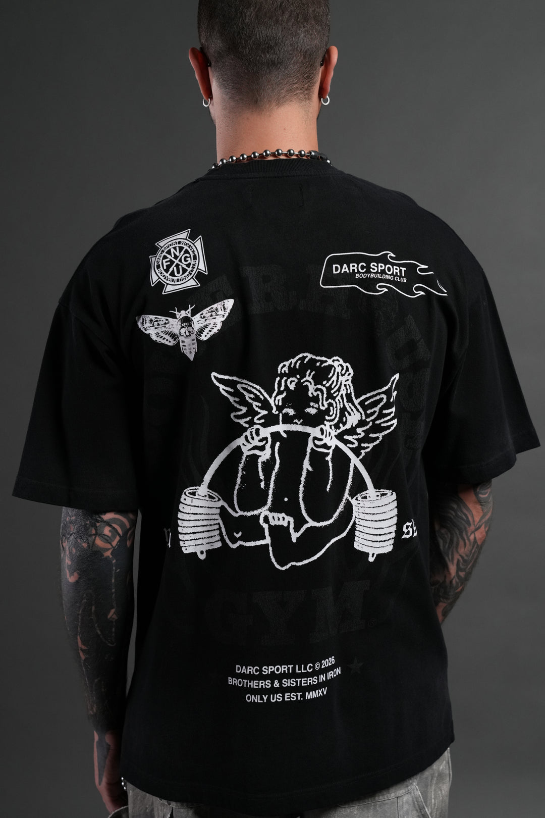 Powerhouse of the Cherub Unisex Premium Oversized Tee in Black Drift Wash