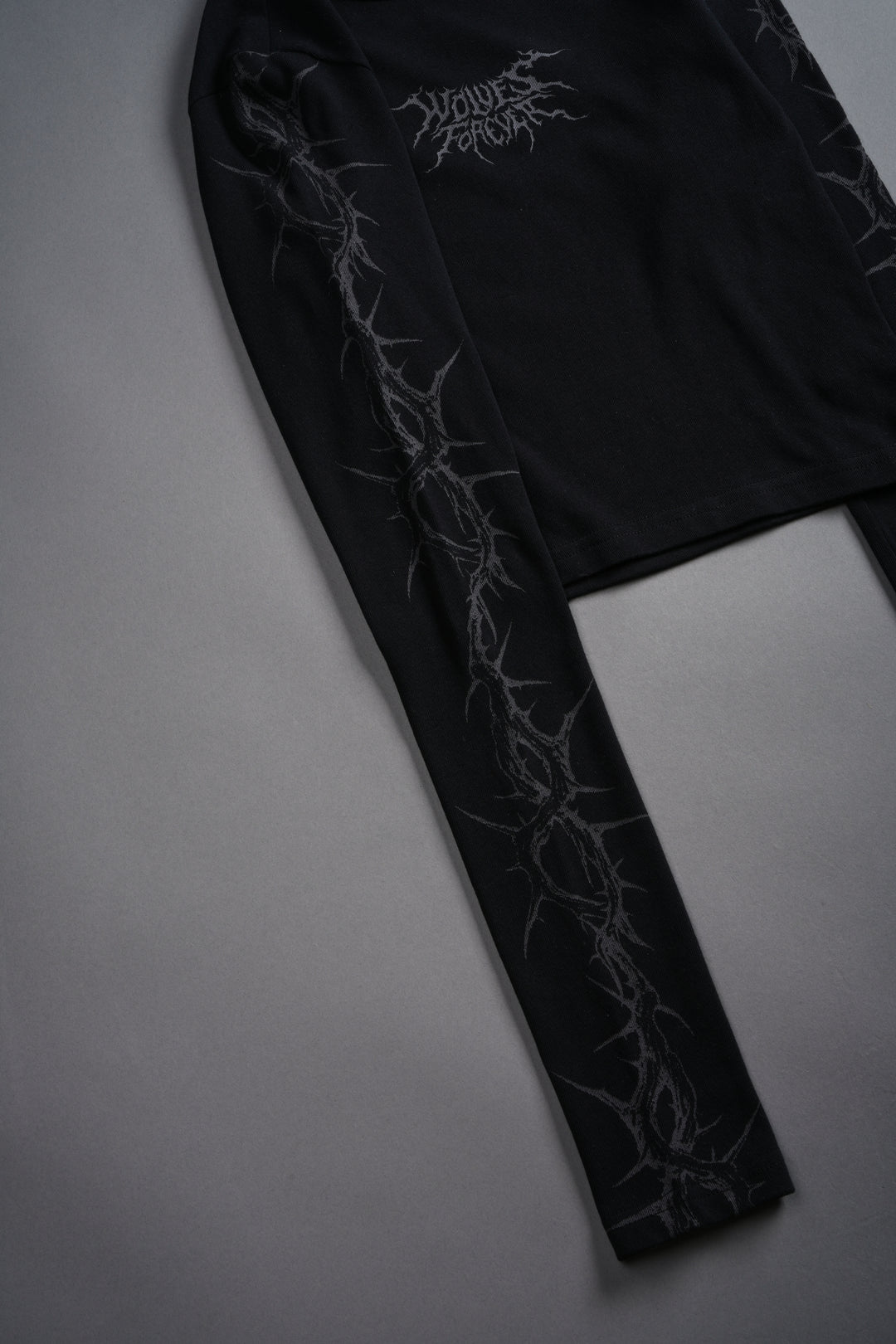 Surrounded by Thorns L/S "Baby" Tee in Black