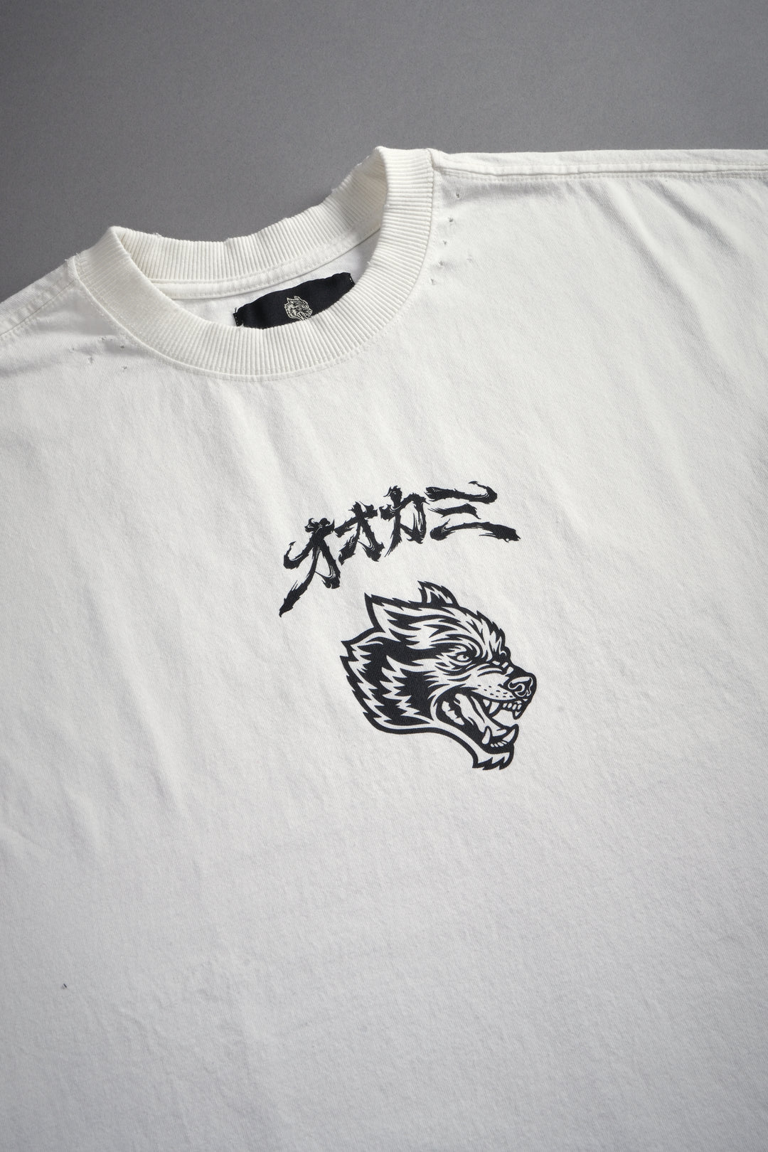 Our Code Distressed Grunge Cut Off Mid Length Raw Hem Tee in Cream
