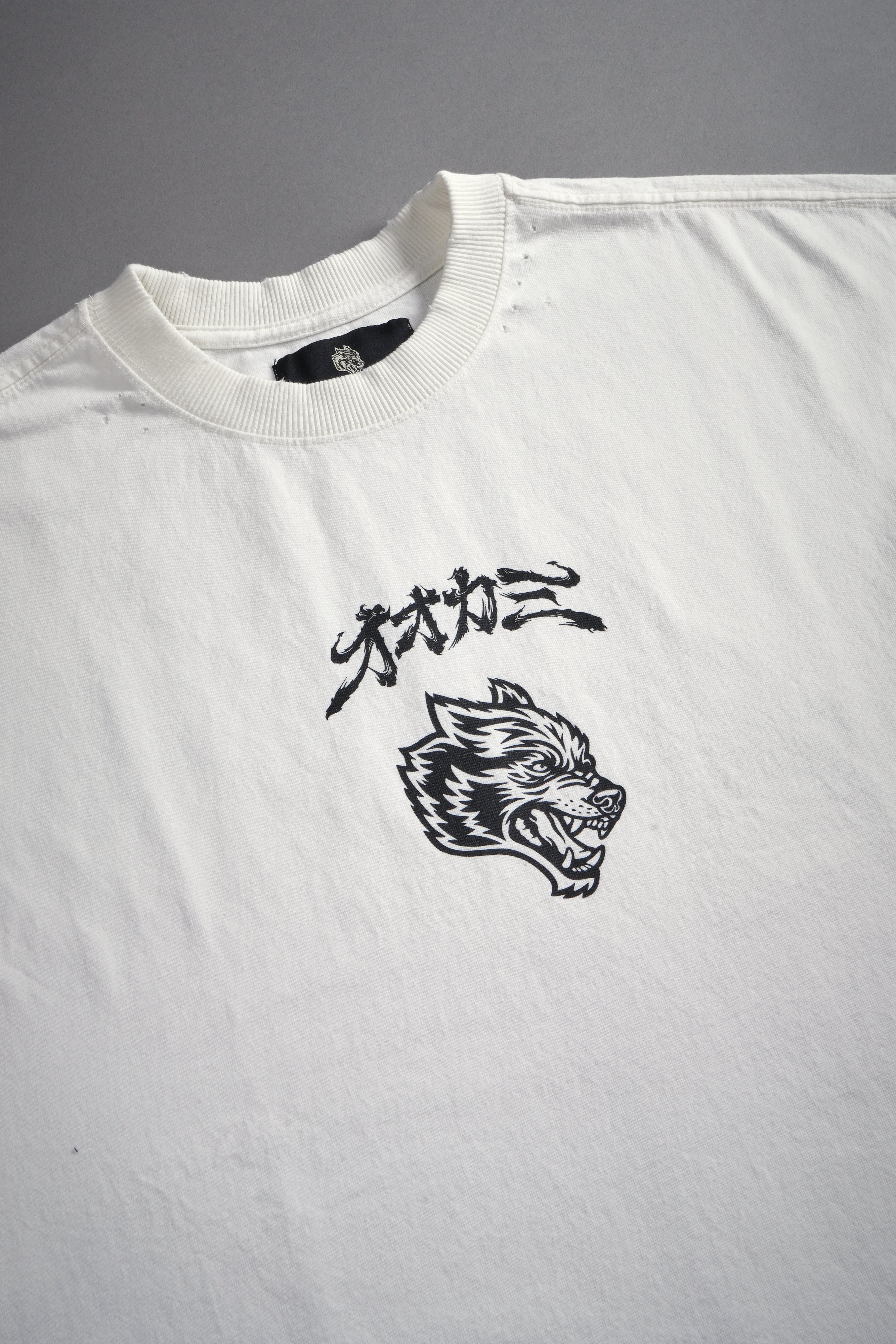 Our Code Distressed Grunge Cut Off Mid Length Raw Hem Tee in Cream
