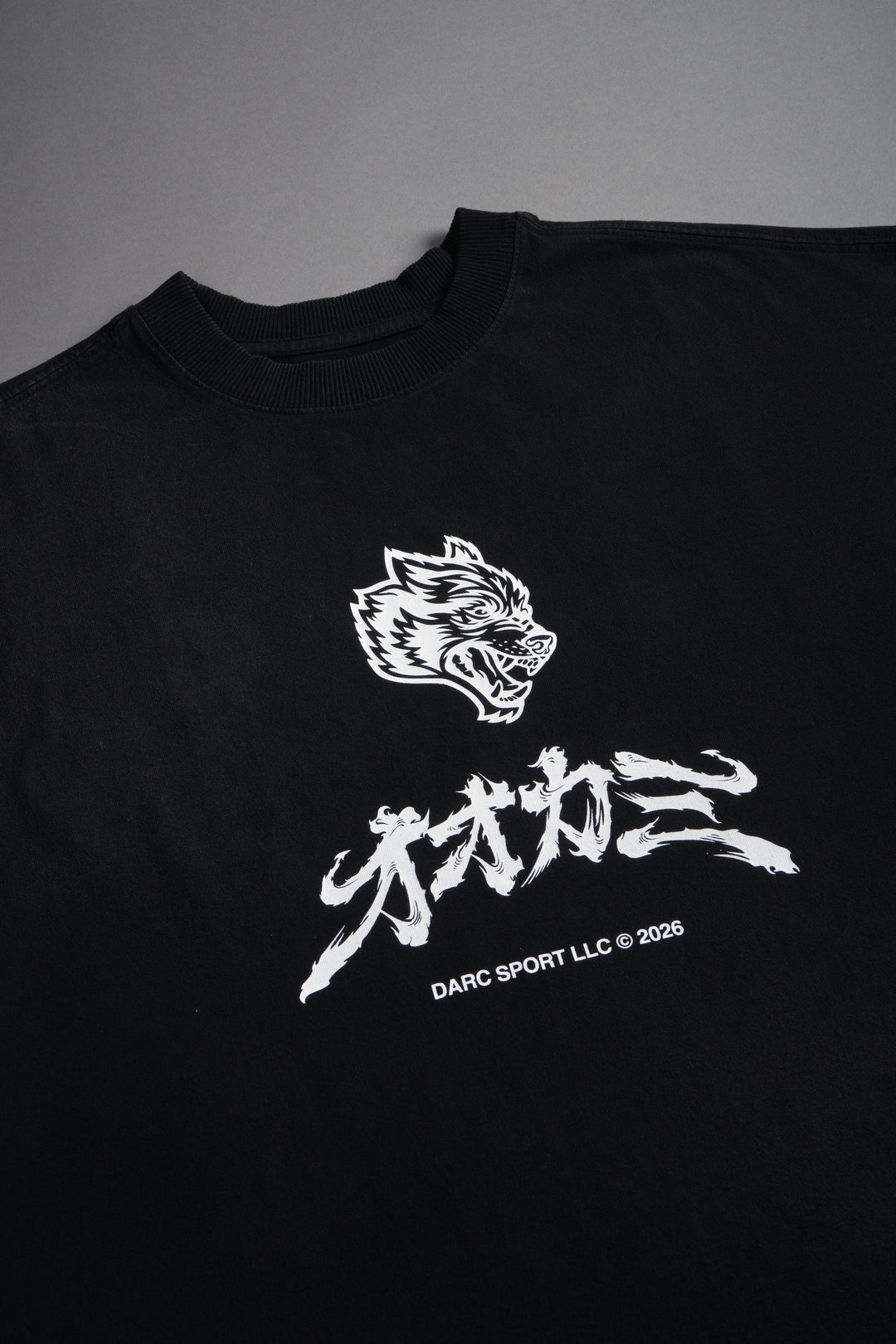 Okami Bushido Grunge Cut-Off Mid Length Raw Hem Tee in Black Sun Fade