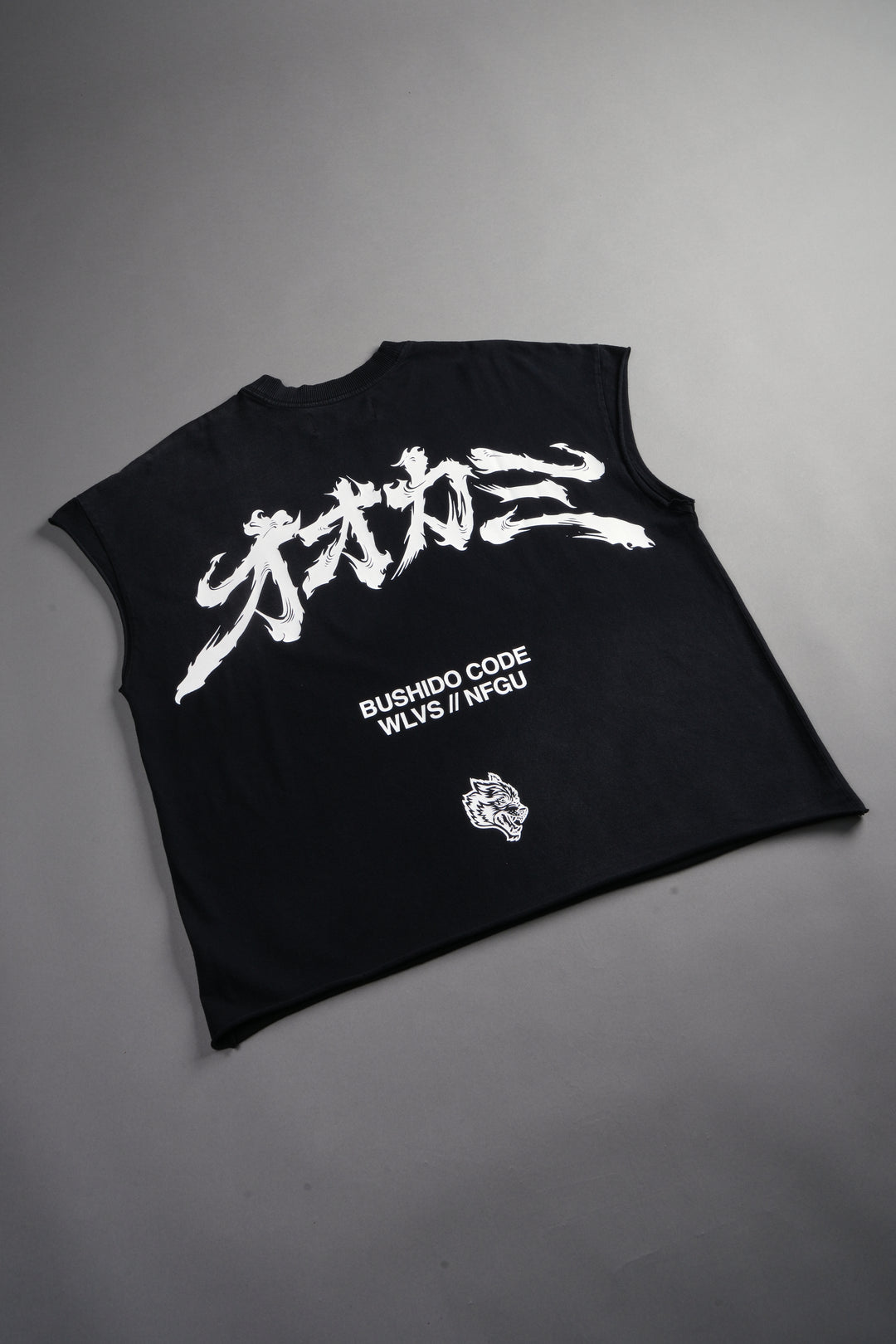 Okami Bushido Grunge Cut-Off Mid Length Raw Hem Tee in Black Sun Fade