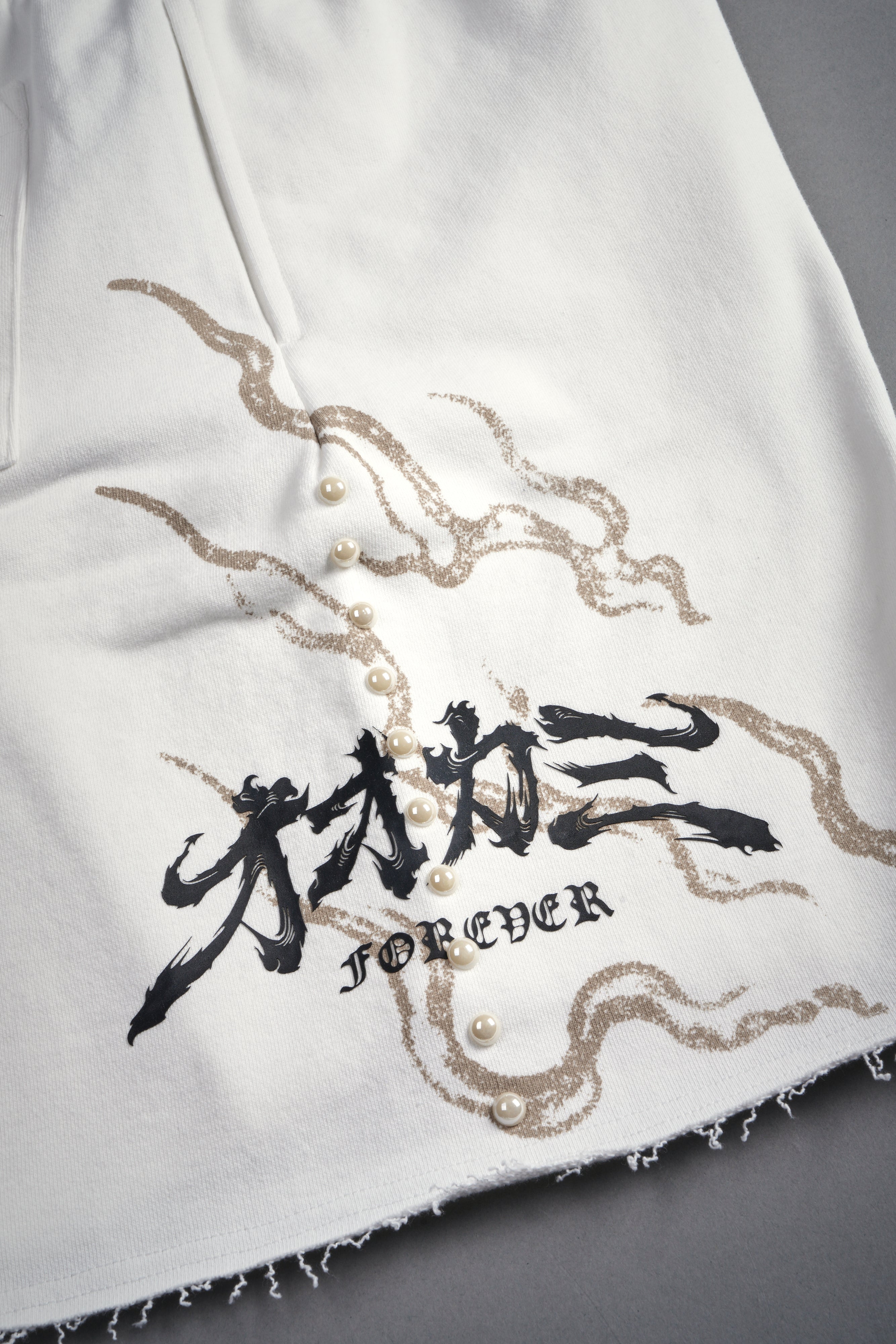 Kokuryu Grunge Oversized Raw Hem Post Lounge Sweat Shorts in Cream