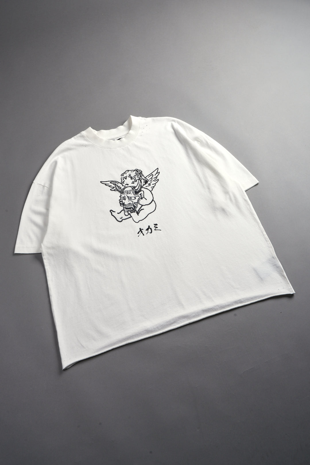 Oni Cherub Distressed Grunge Mid Length Raw Hem Tee in Cream