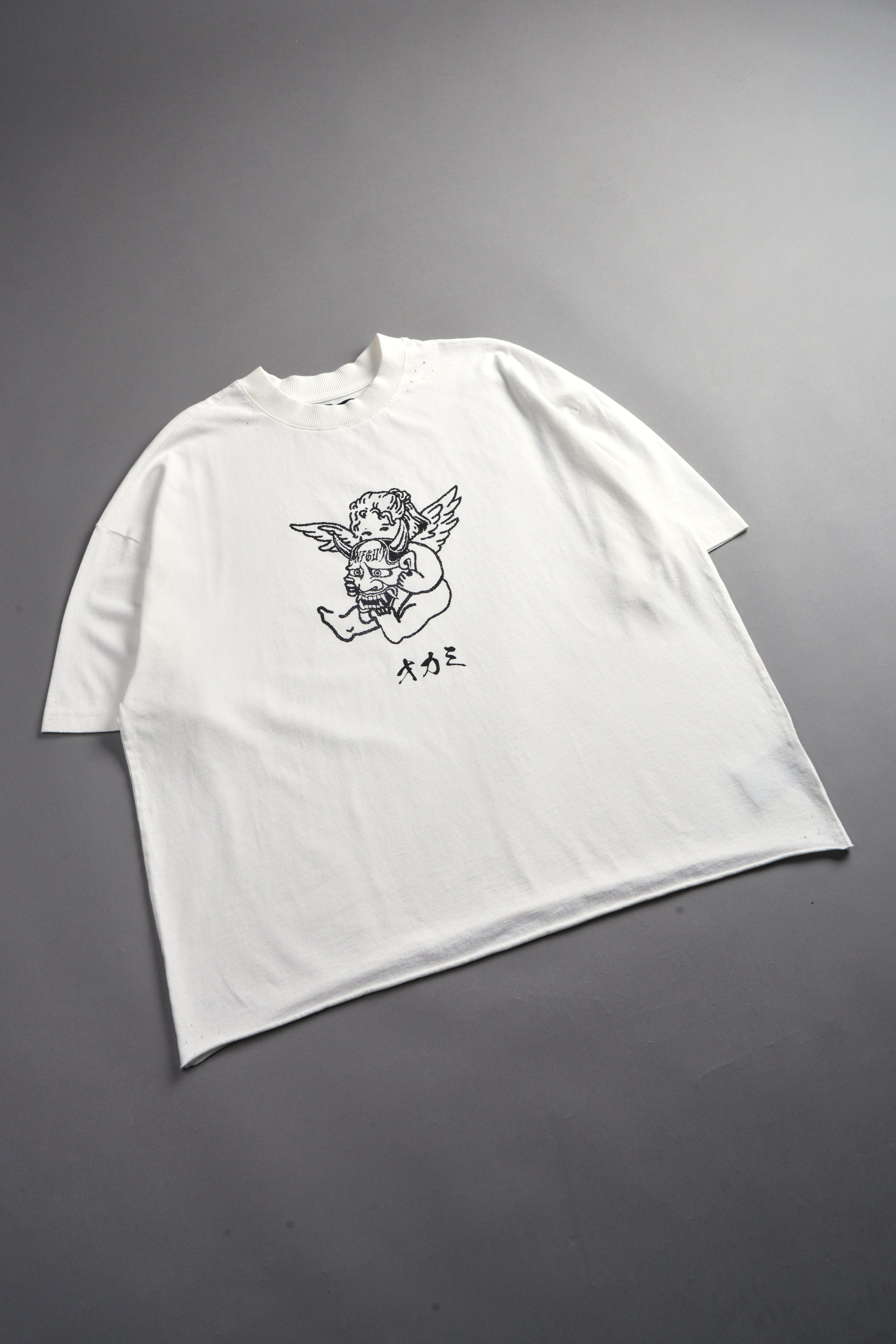 Oni Cherub Distressed Grunge Mid Length Raw Hem Tee in Cream