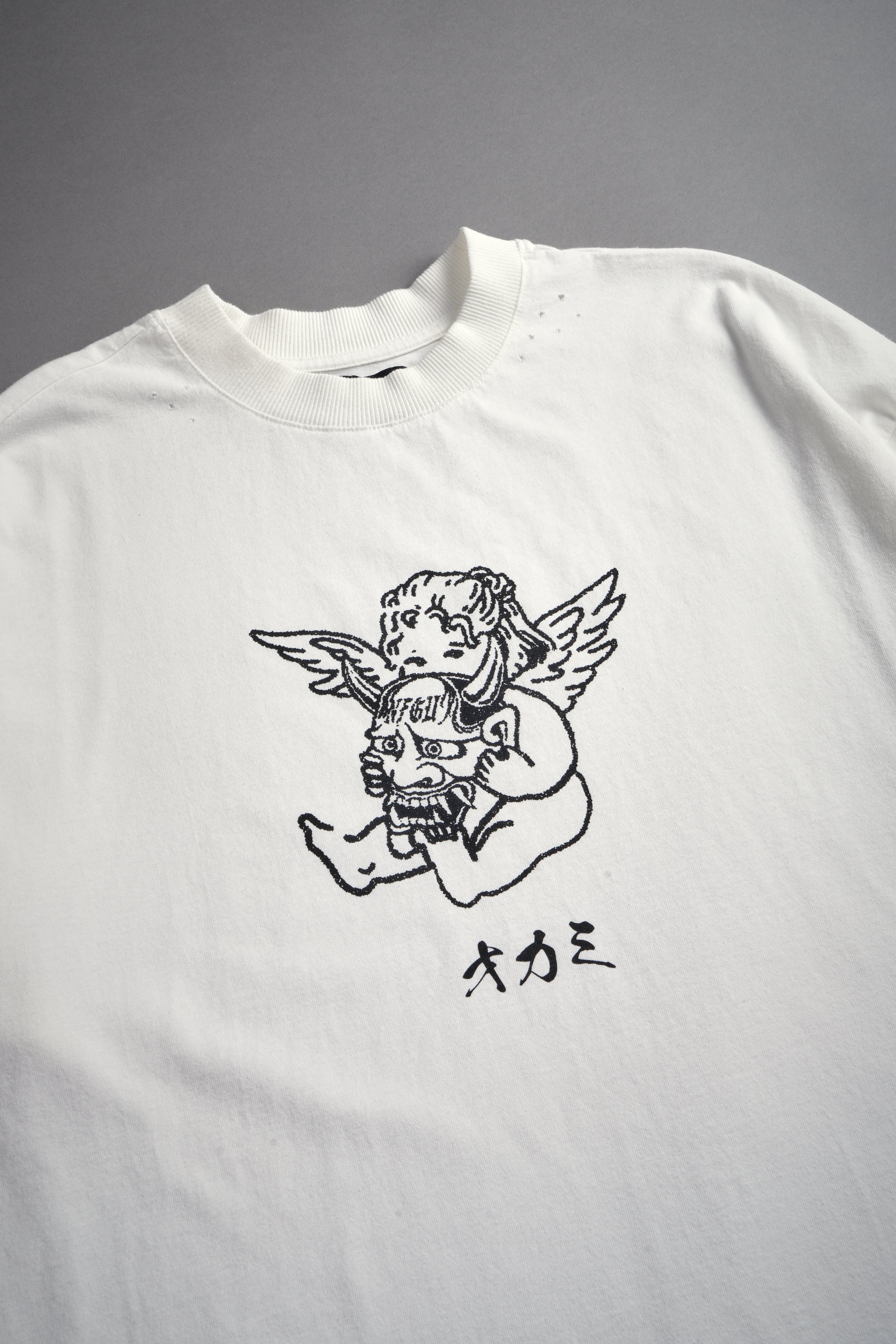 Oni Cherub Distressed Grunge Mid Length Raw Hem Tee in Cream