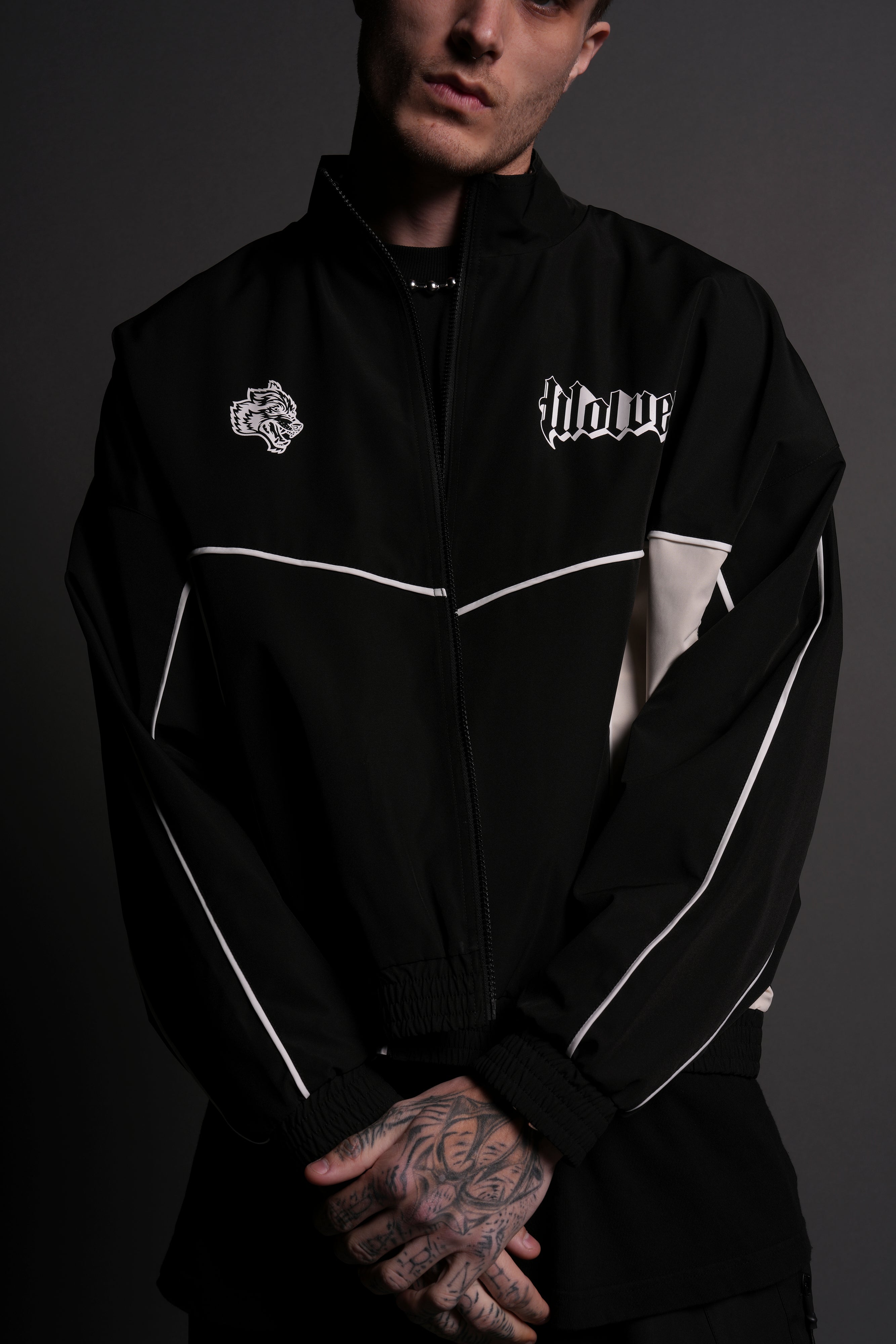 Our Passion Quinn Unisex Track Jacket in Black/Sand