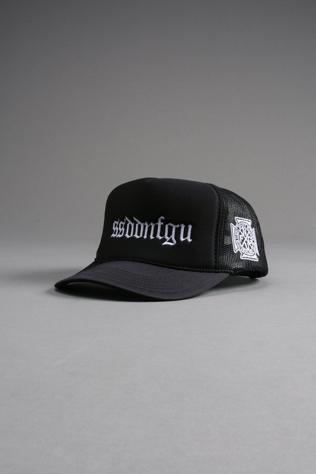 Our Mantra Trucker Hat in Black