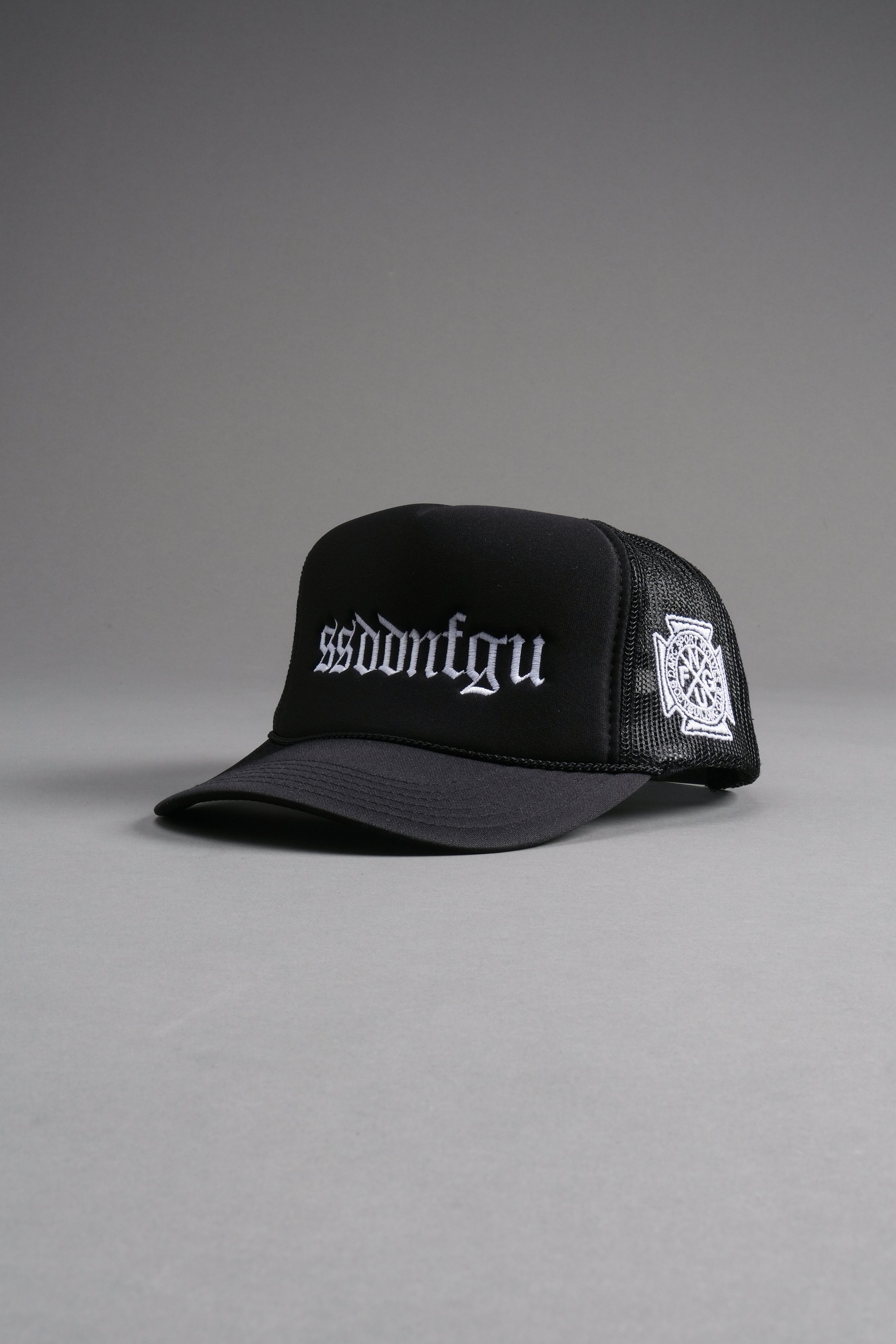 Our Mantra Trucker Hat in Black