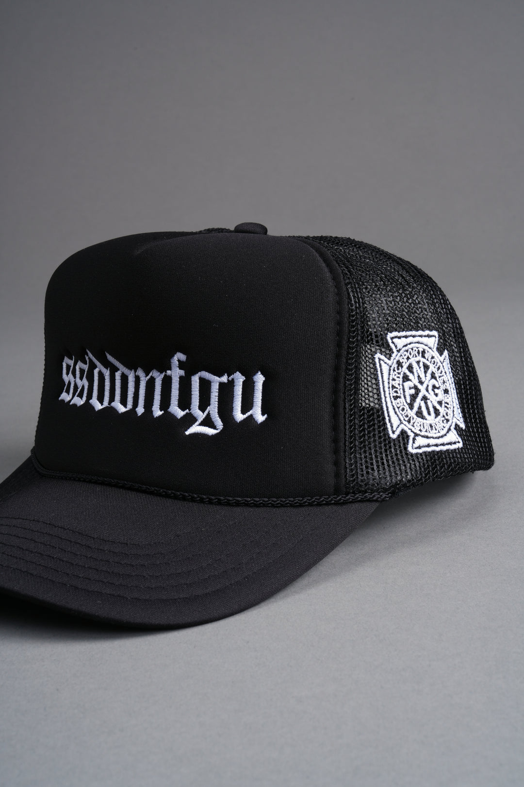 Our Mantra Trucker Hat in Black