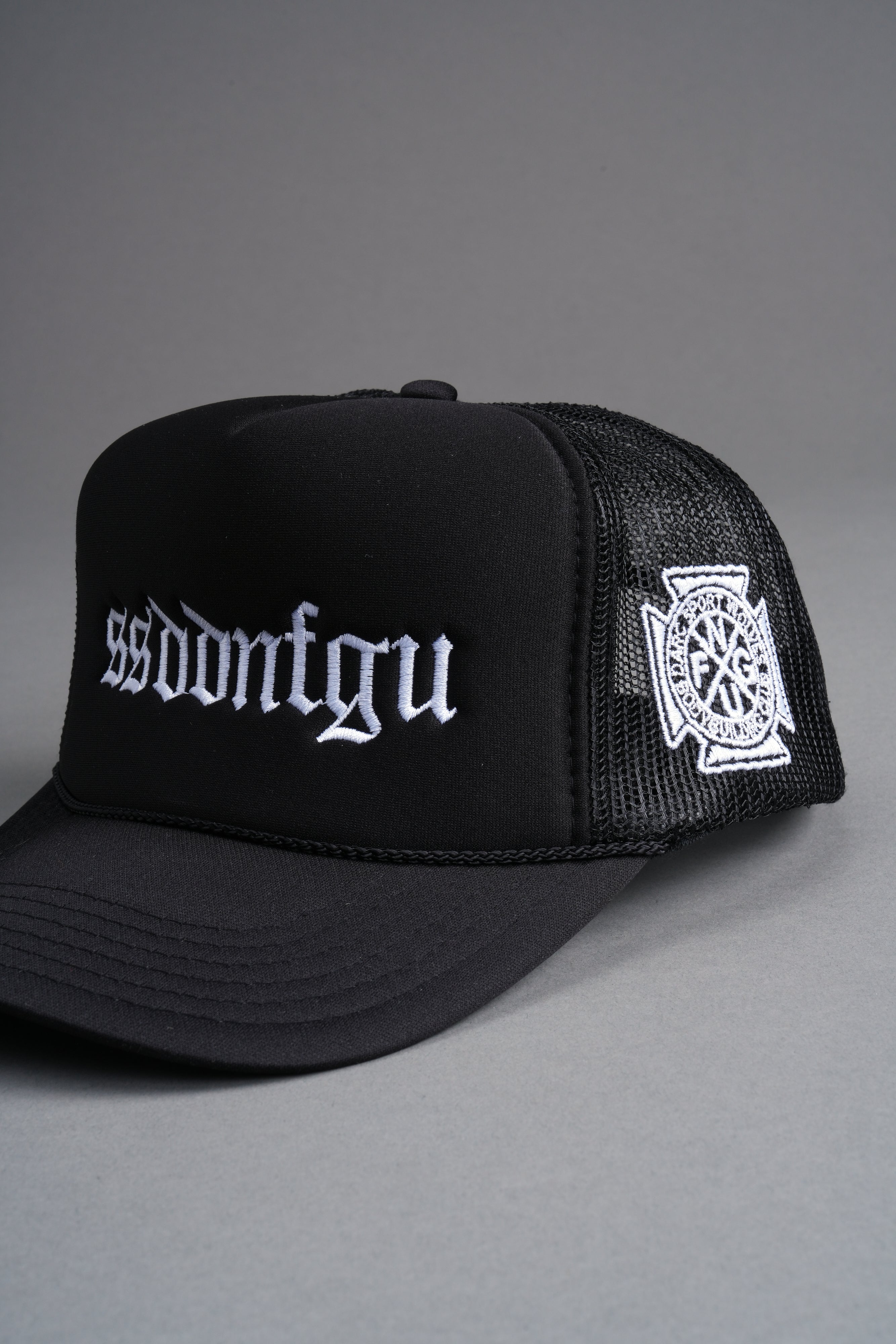 Our Mantra Trucker Hat in Black