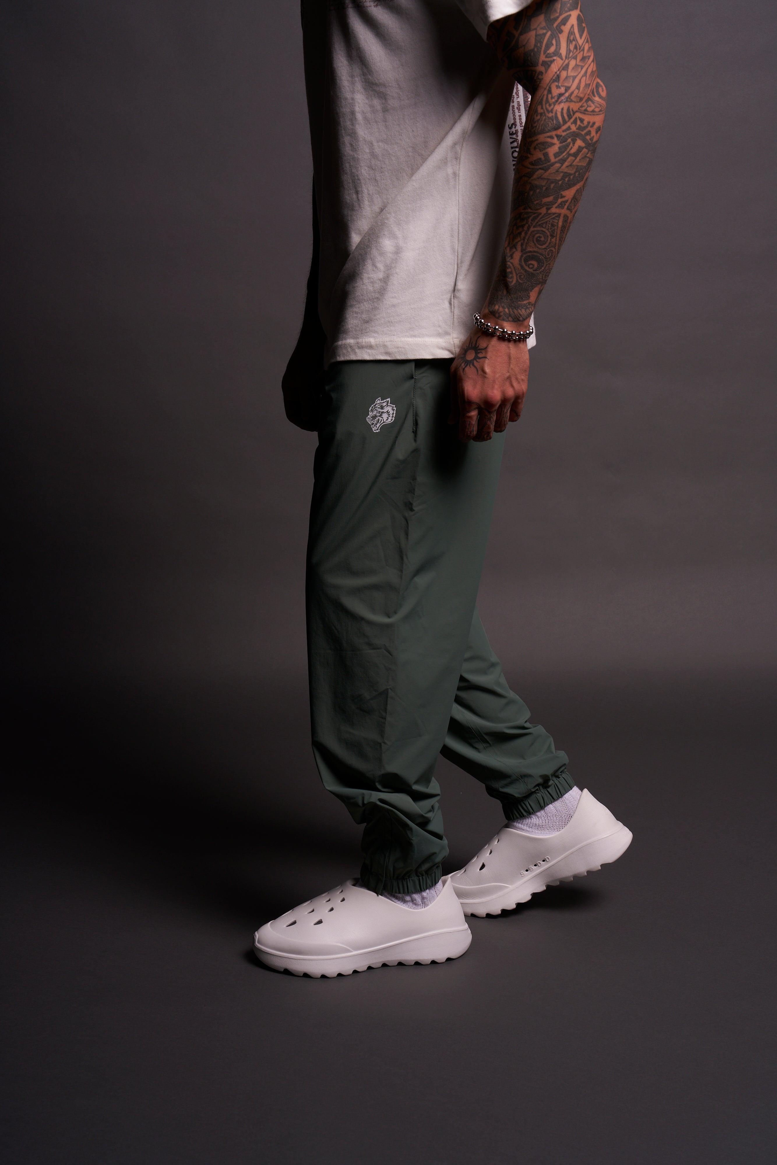 Dual Wolf Head Hybrid Nylon Track Pants in Hunter Green