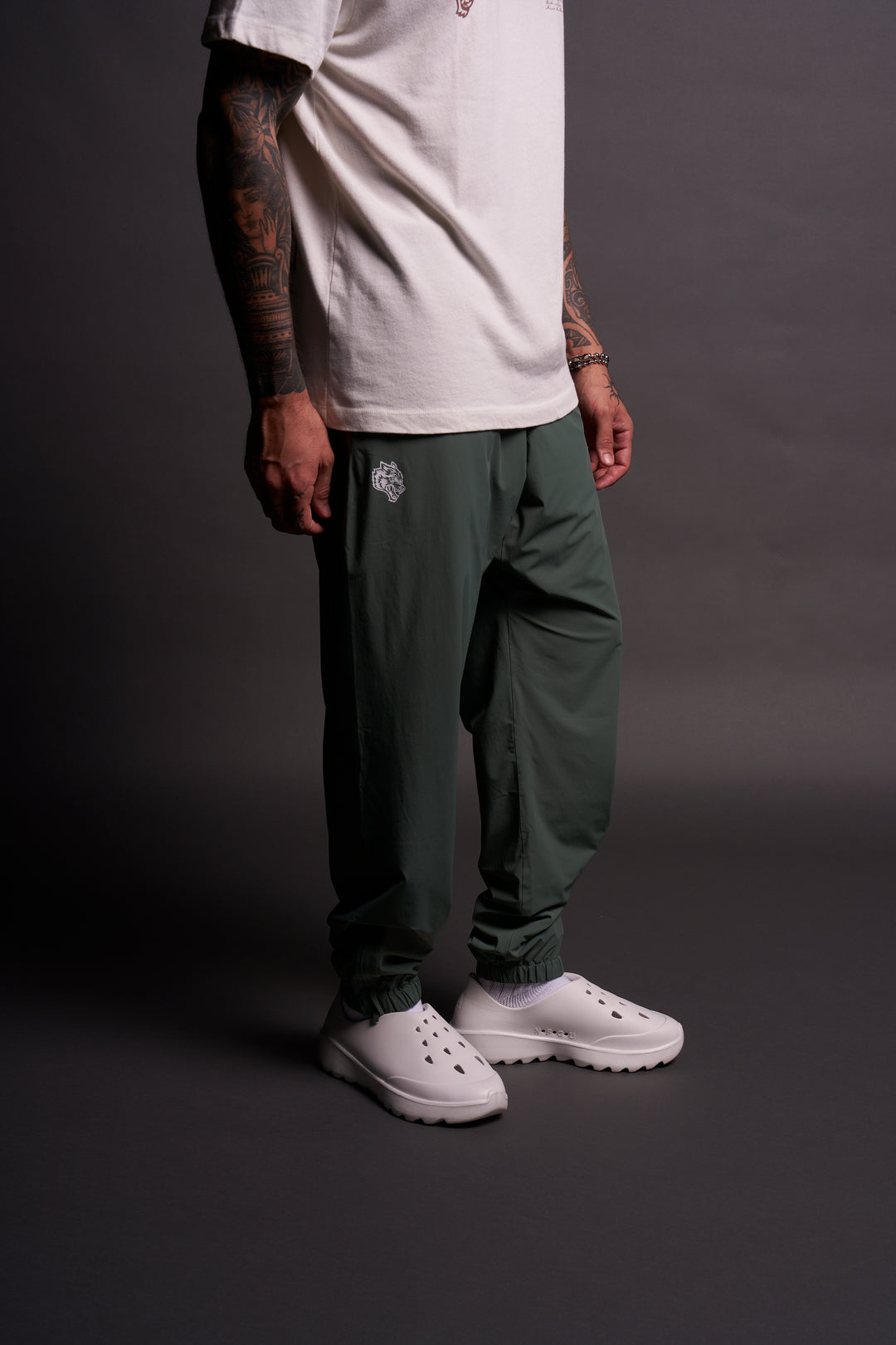 Dual Wolf Head Hybrid Nylon Track Pants in Hunter Green