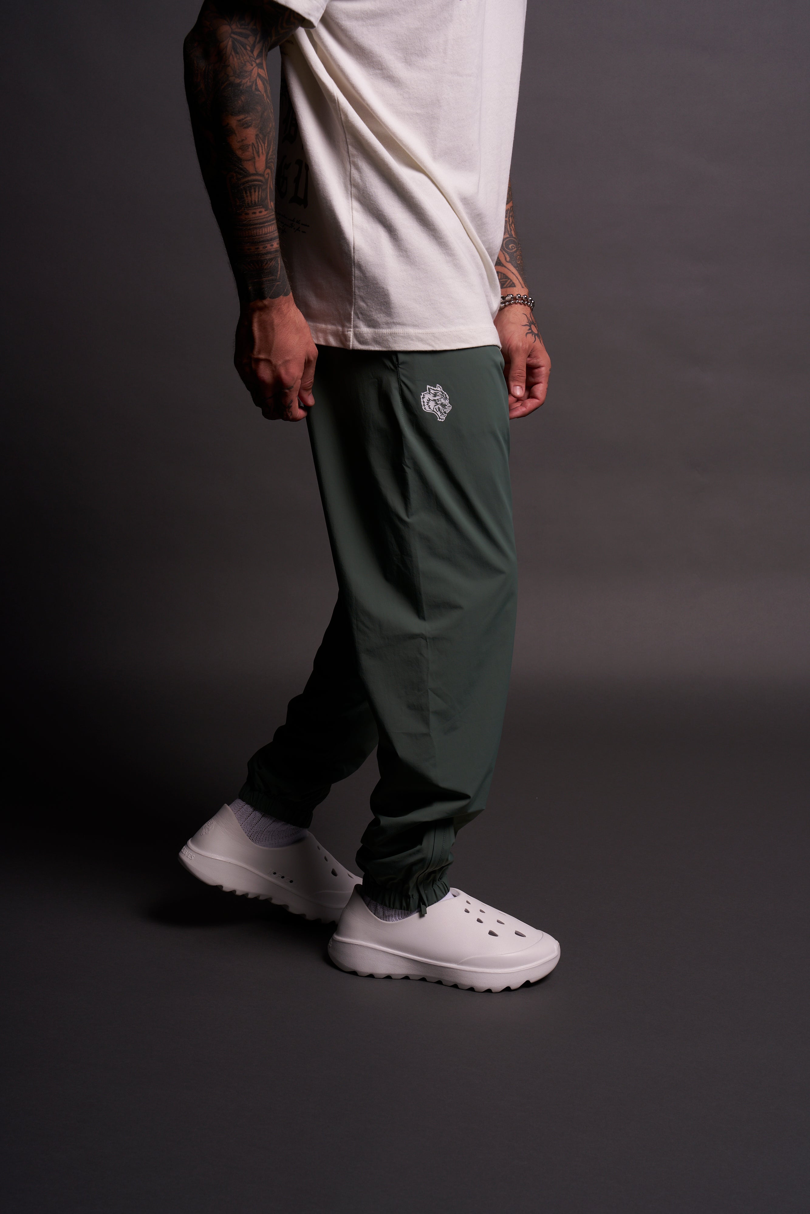 Dual Wolf Head Hybrid Nylon Track Pants in Hunter Green