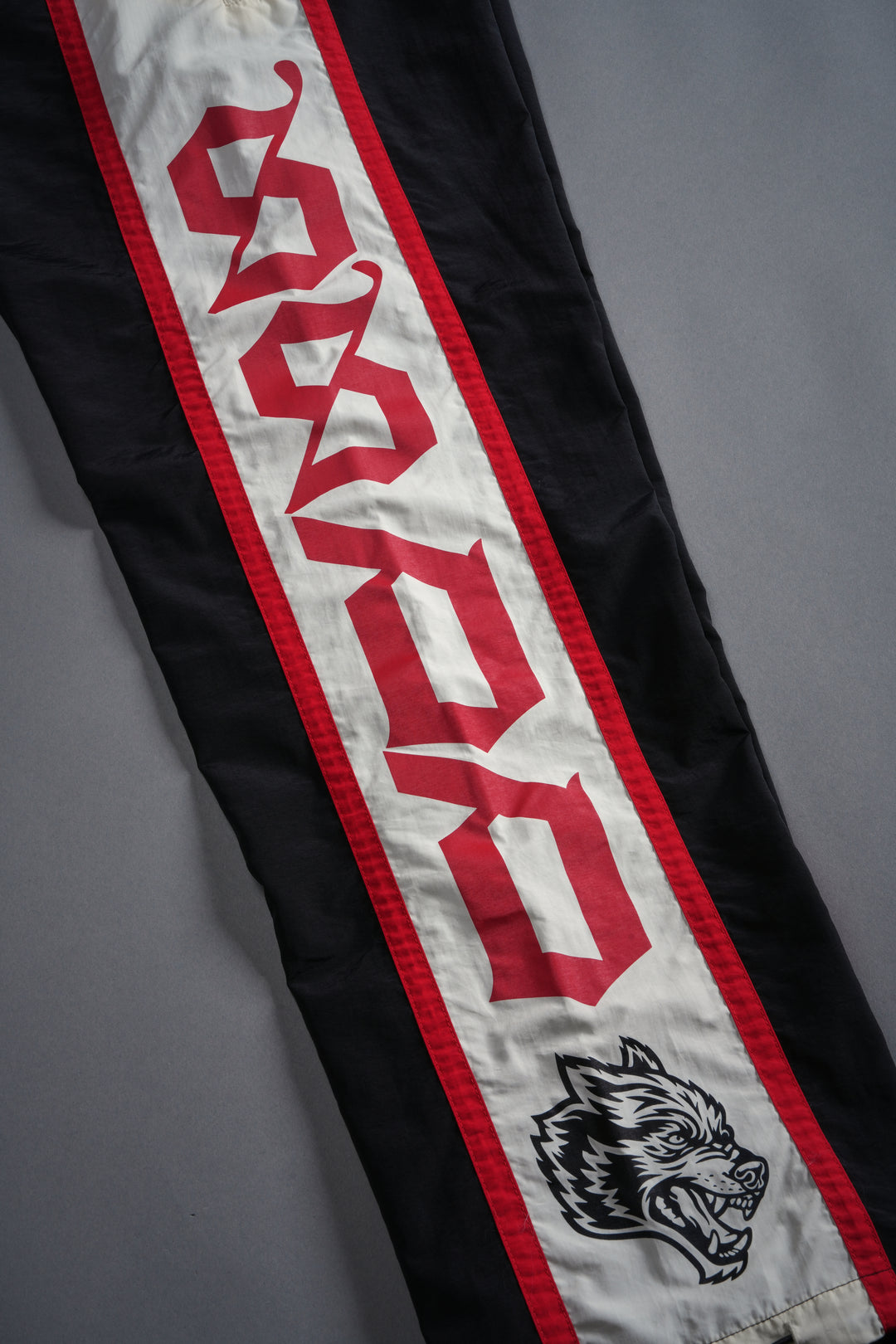 SSDDNFGU Remind Track Pants in Black/Cream/Red