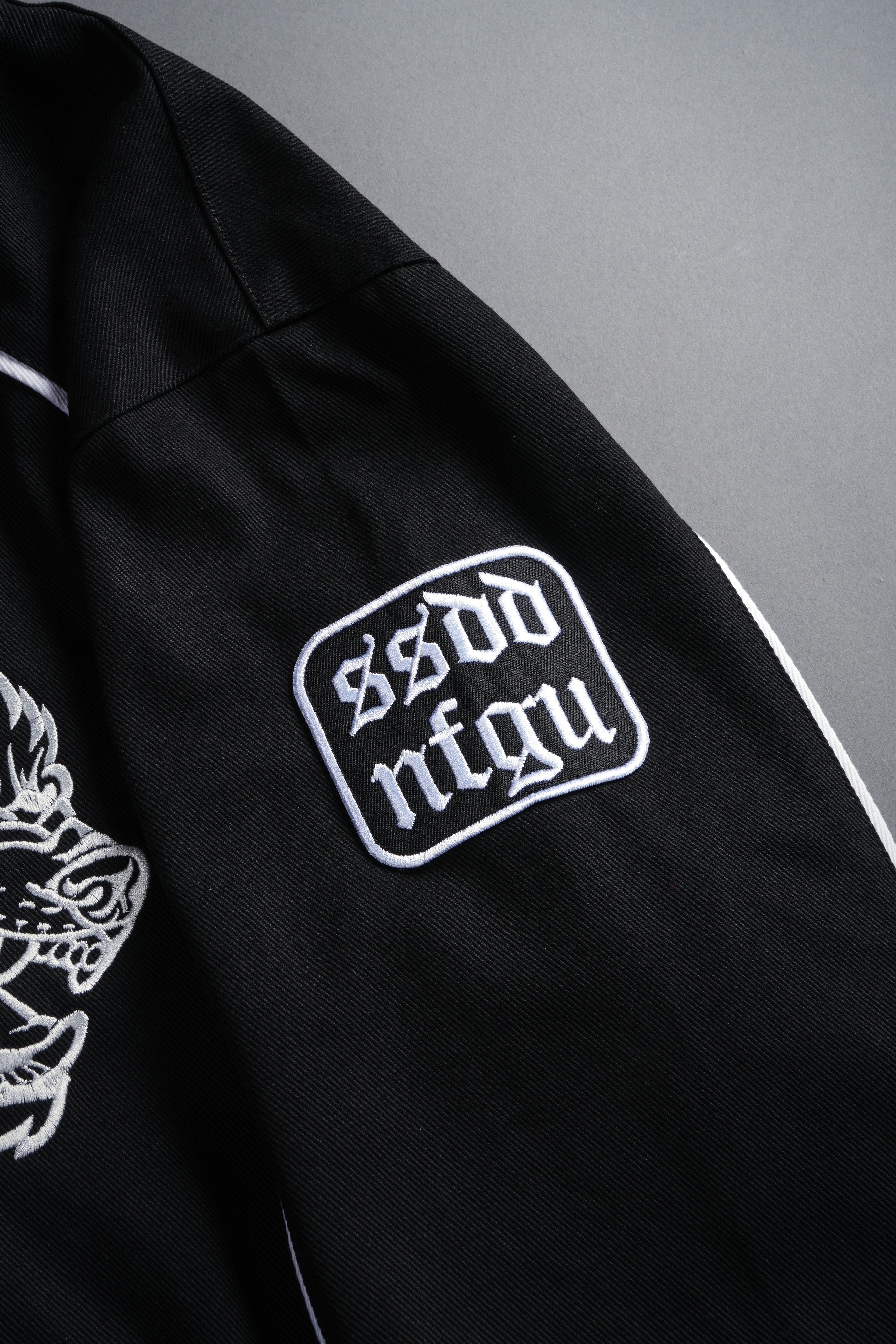 IYKYK Grit Road Racing Jacket in Black/White