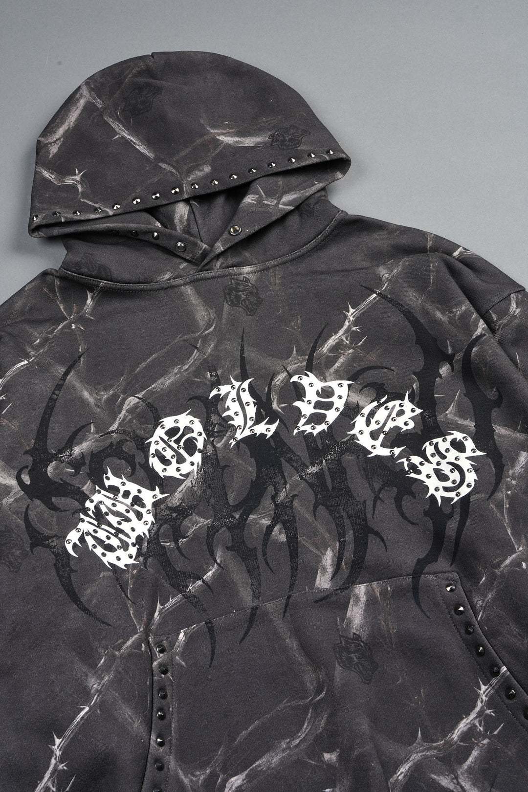 Studded Mantra Pierce Hoodie In Darc Thorns