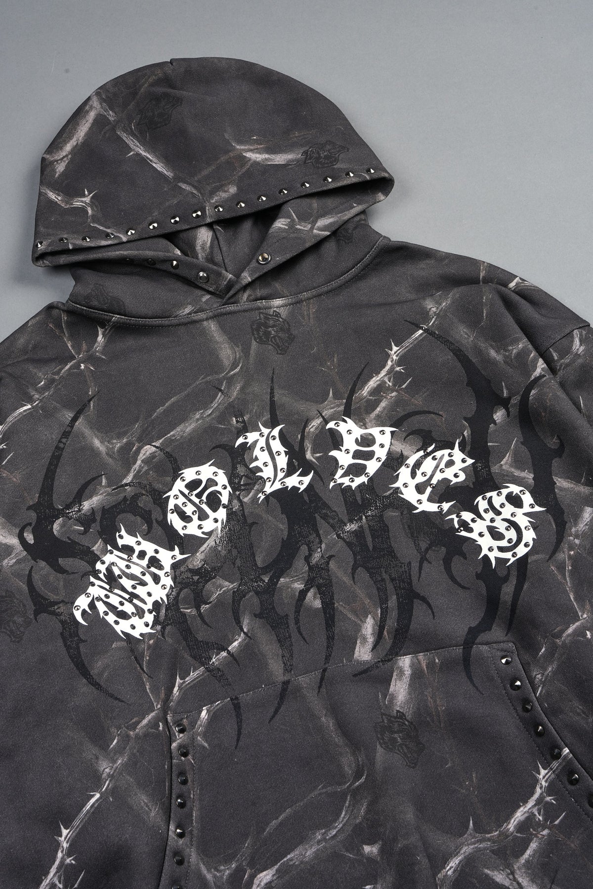 Studded Mantra Pierce Hoodie In Darc Thorns