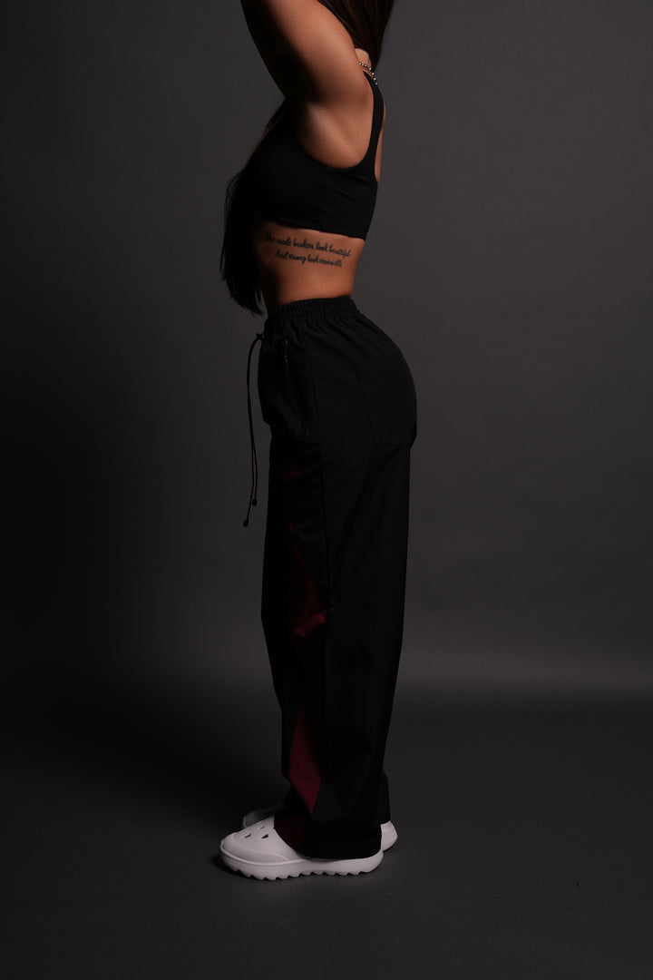 Dual Wolf Chopper She Brolic Track Pants in Black/Oxblood