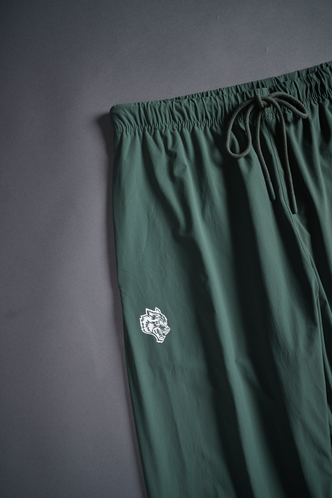 Dual Wolf Head Hybrid Nylon Track Pants in Hunter Green