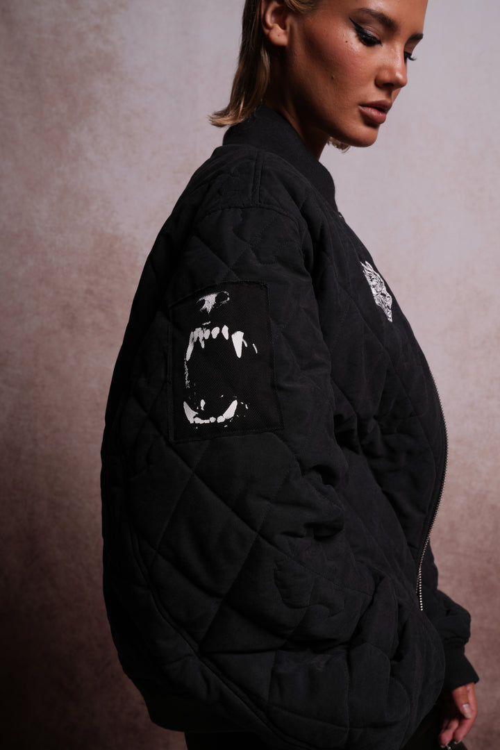 Patched Wolf Hesh Cloud Quilted Reversible Bomber Jacket in Black