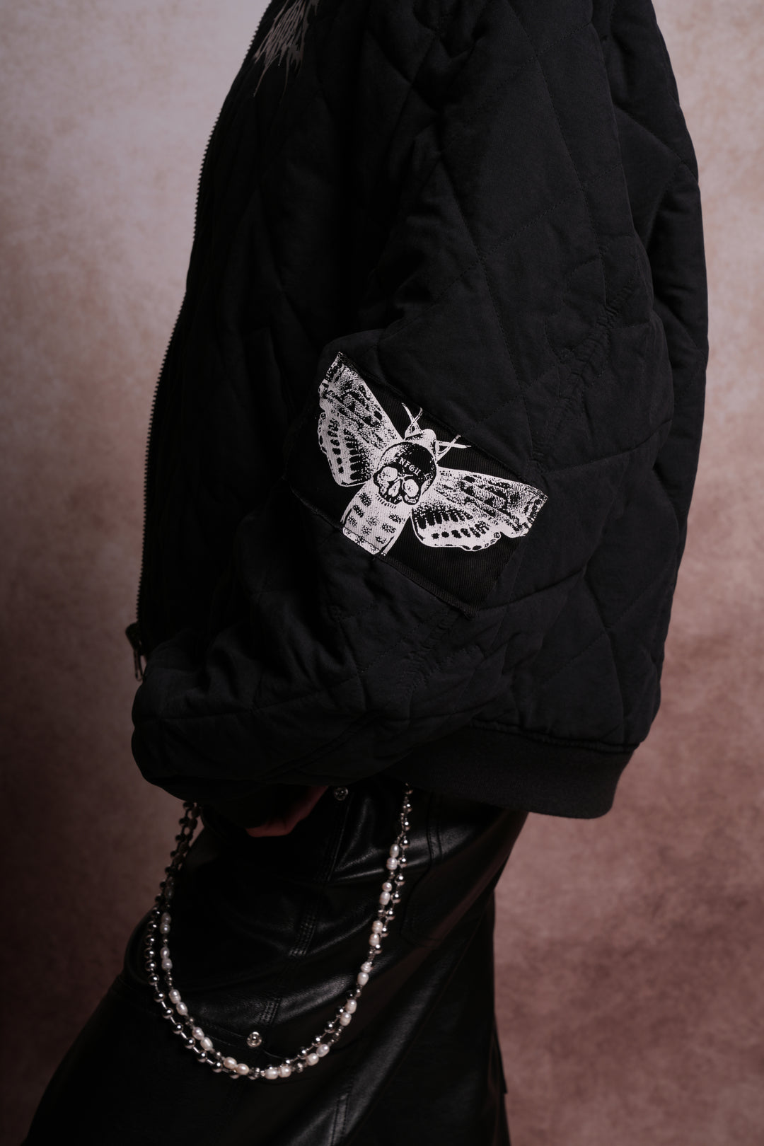 Patched Wolf Hesh Cloud Quilted Reversible Bomber Jacket in Black