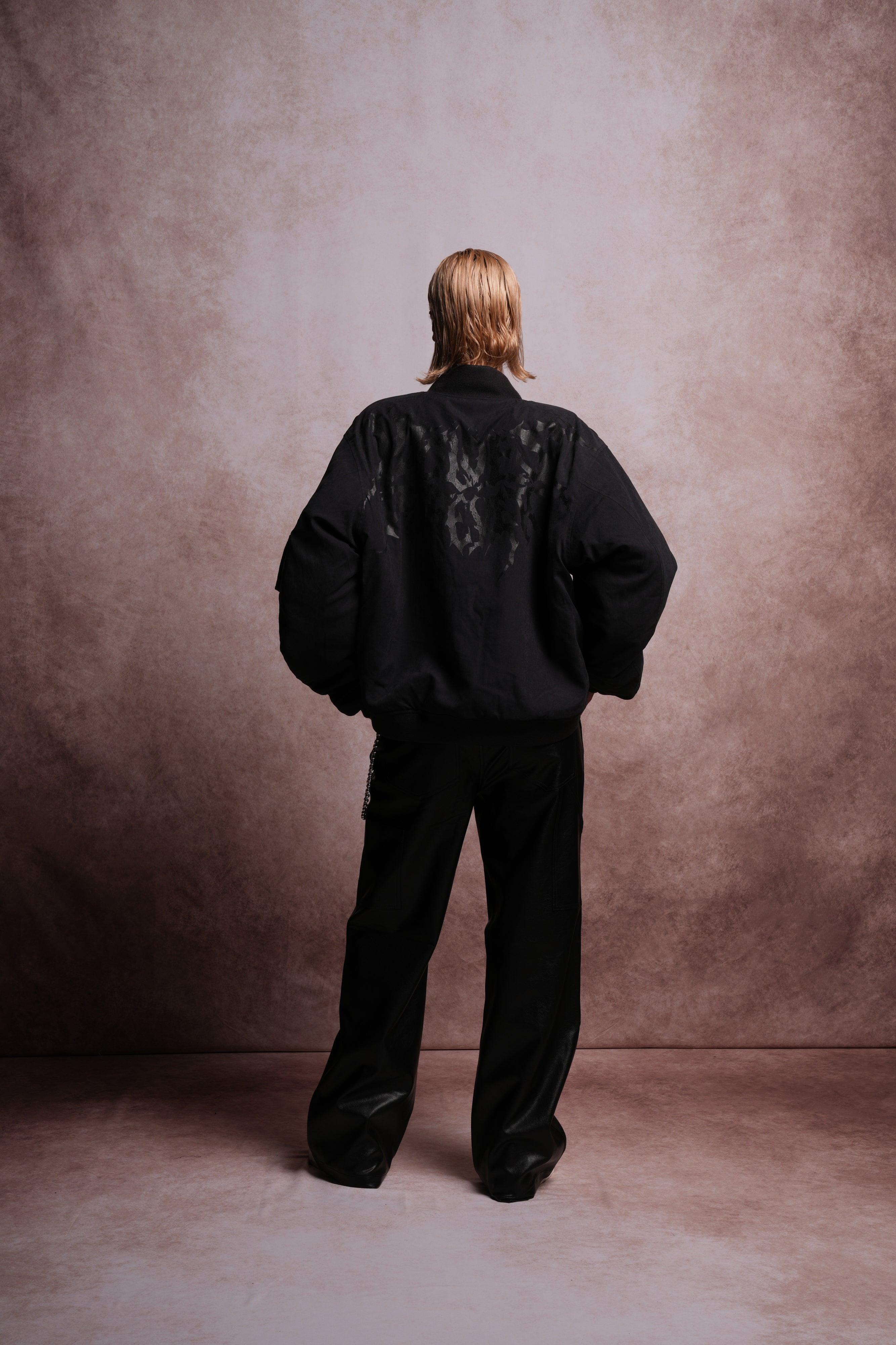 Patched Wolf Hesh Cloud Quilted Reversible Bomber Jacket in Black