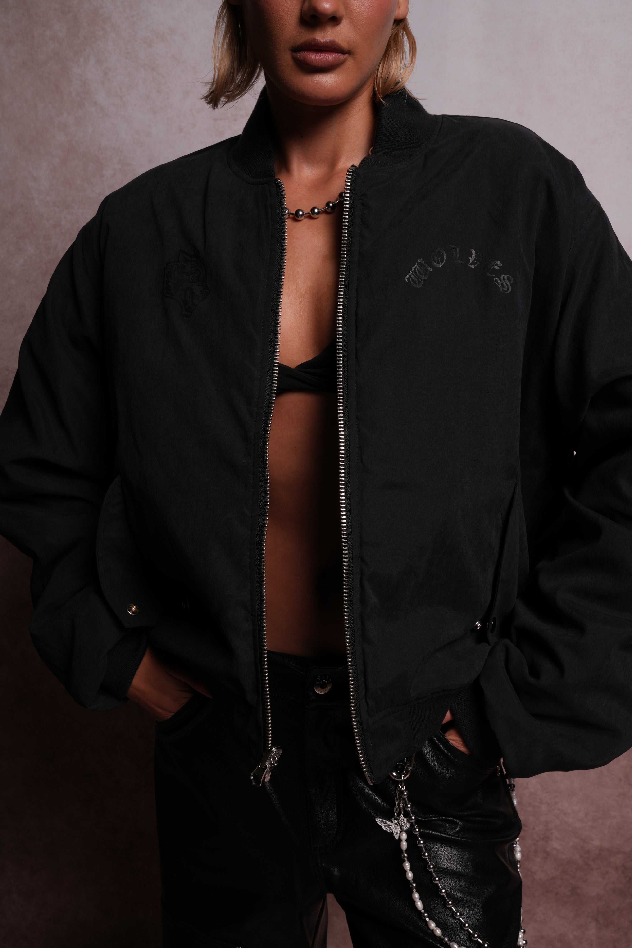 Patched Wolf Hesh Cloud Quilted Reversible Bomber Jacket in Black
