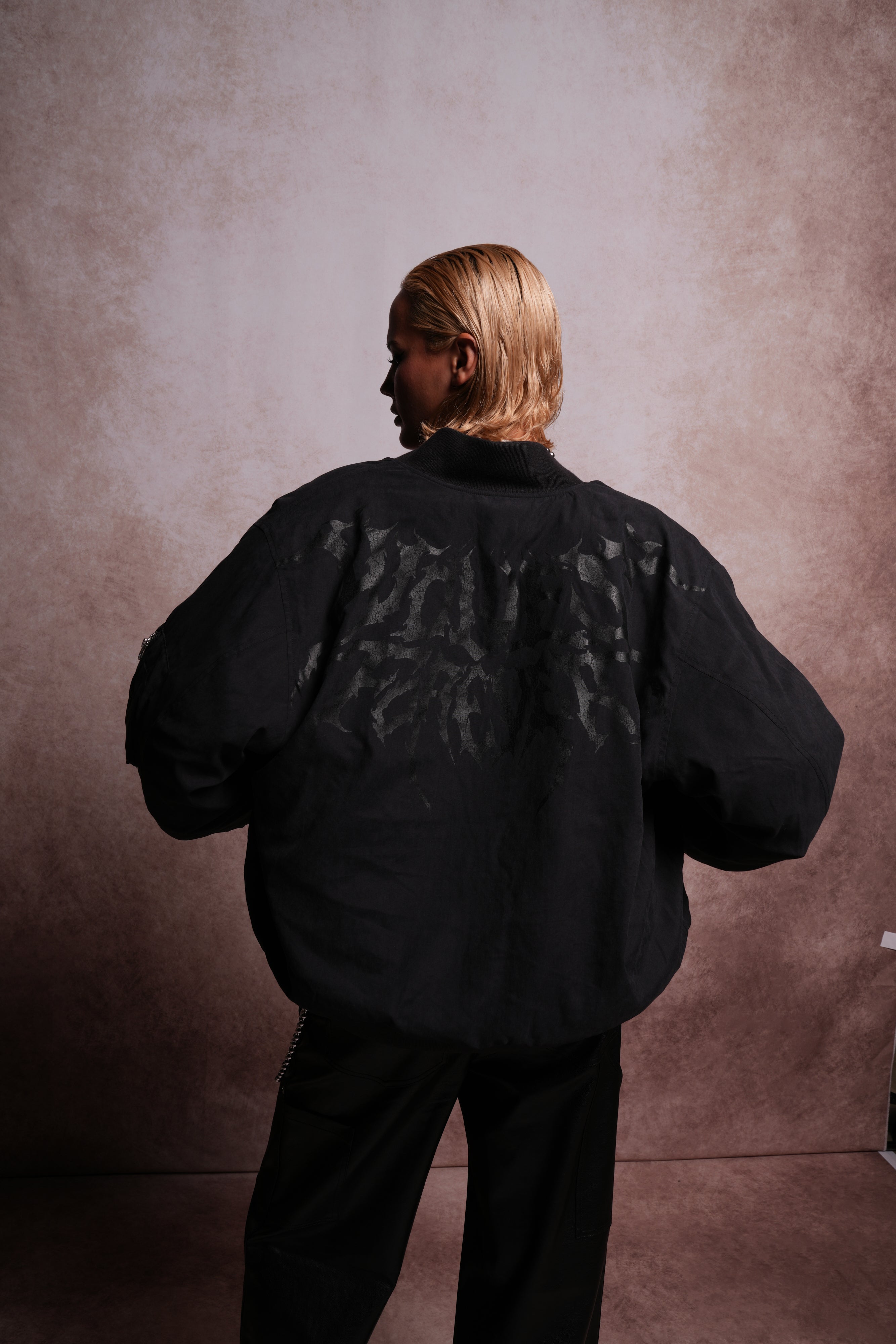 Patched Wolf Hesh Cloud Quilted Reversible Bomber Jacket in Black