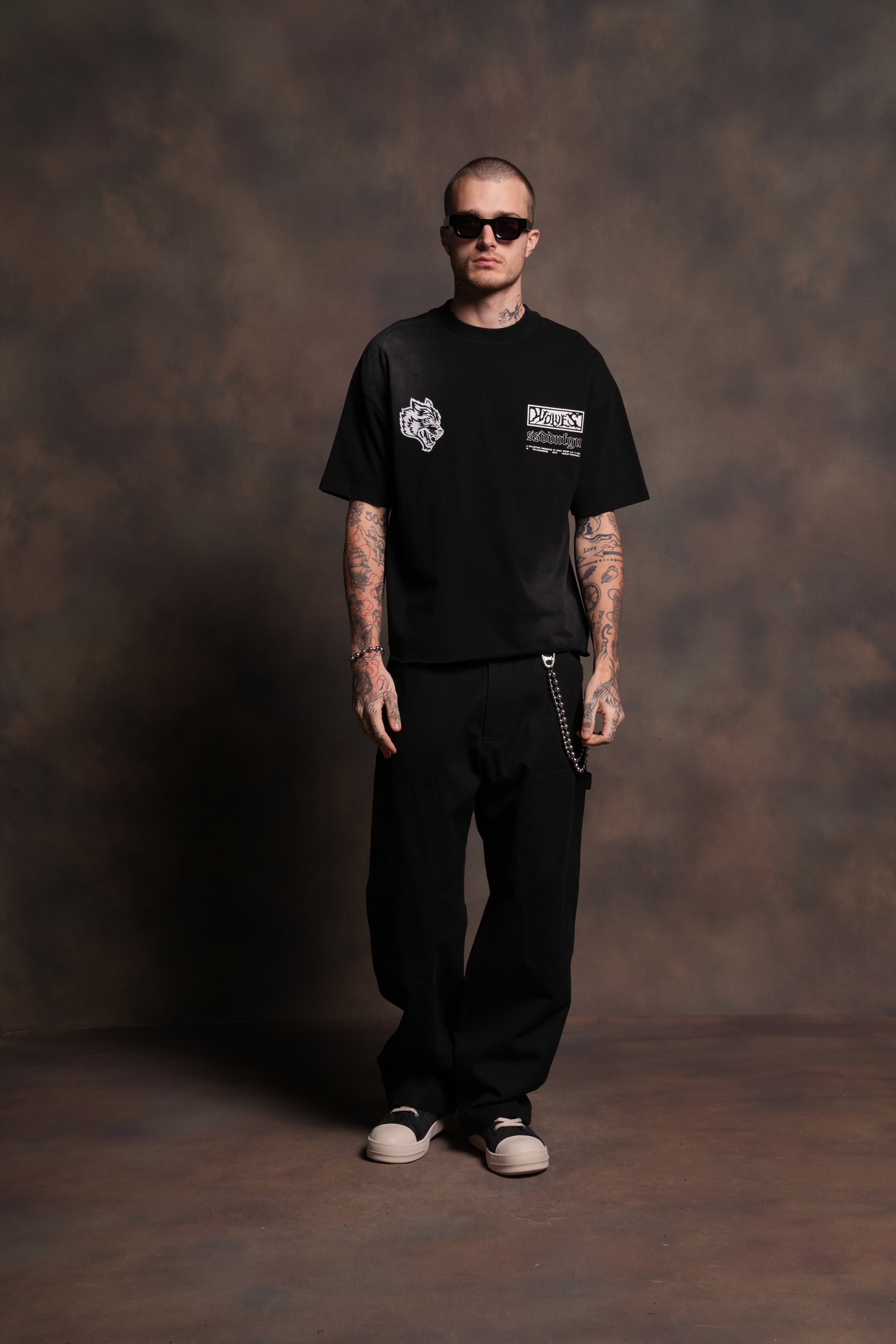 Ride Forever Distressed Grunge Mid-Length Raw Hem Tee in Black Sun Fade