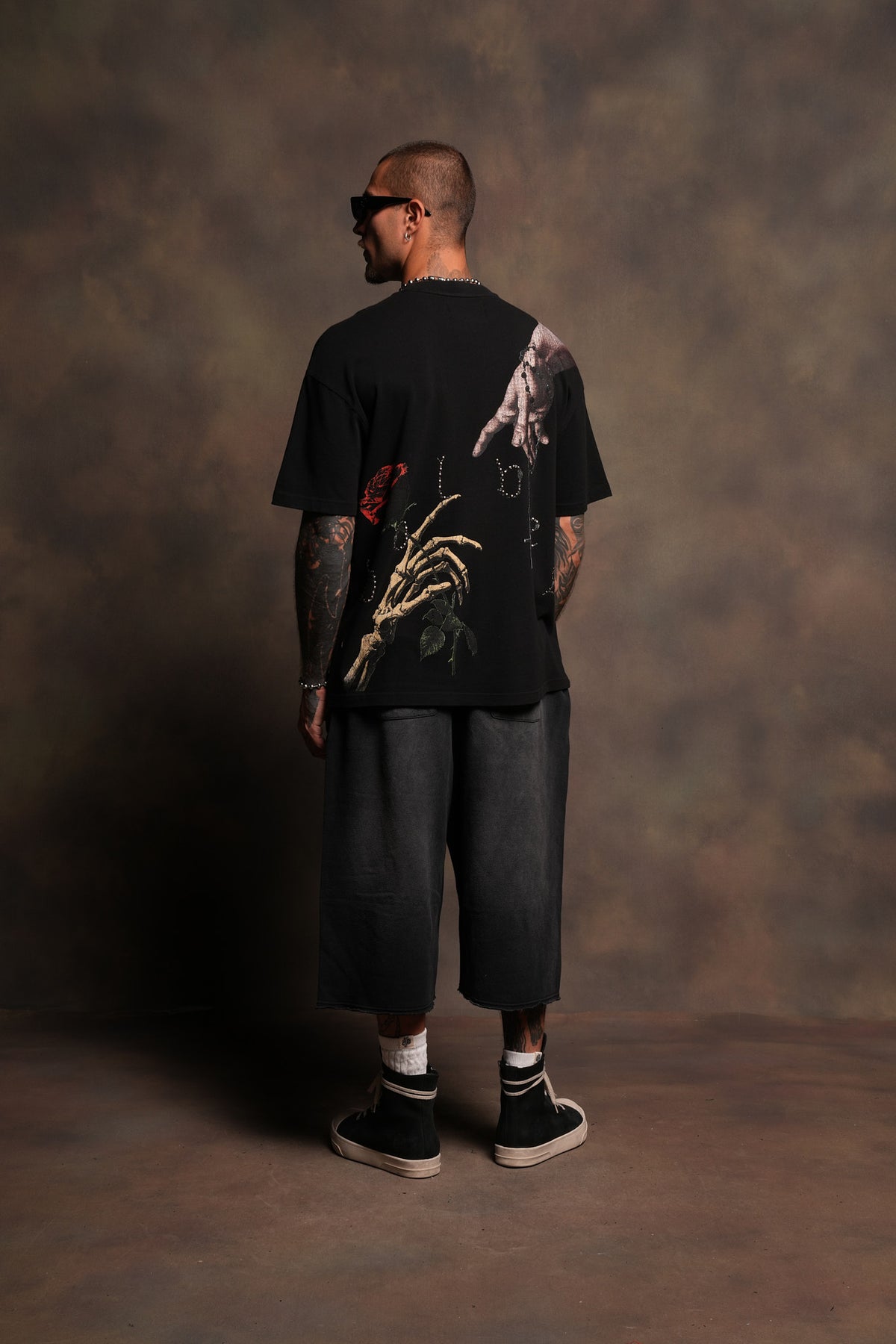 Hand That Holds Premium Oversized Tee In Black