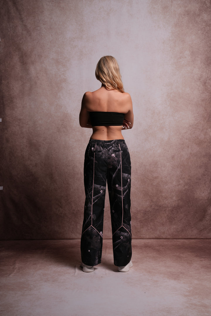 Dual Wolf Quinn Track Pants in Darc Blossom Woodland Camo/Cherry Blossom