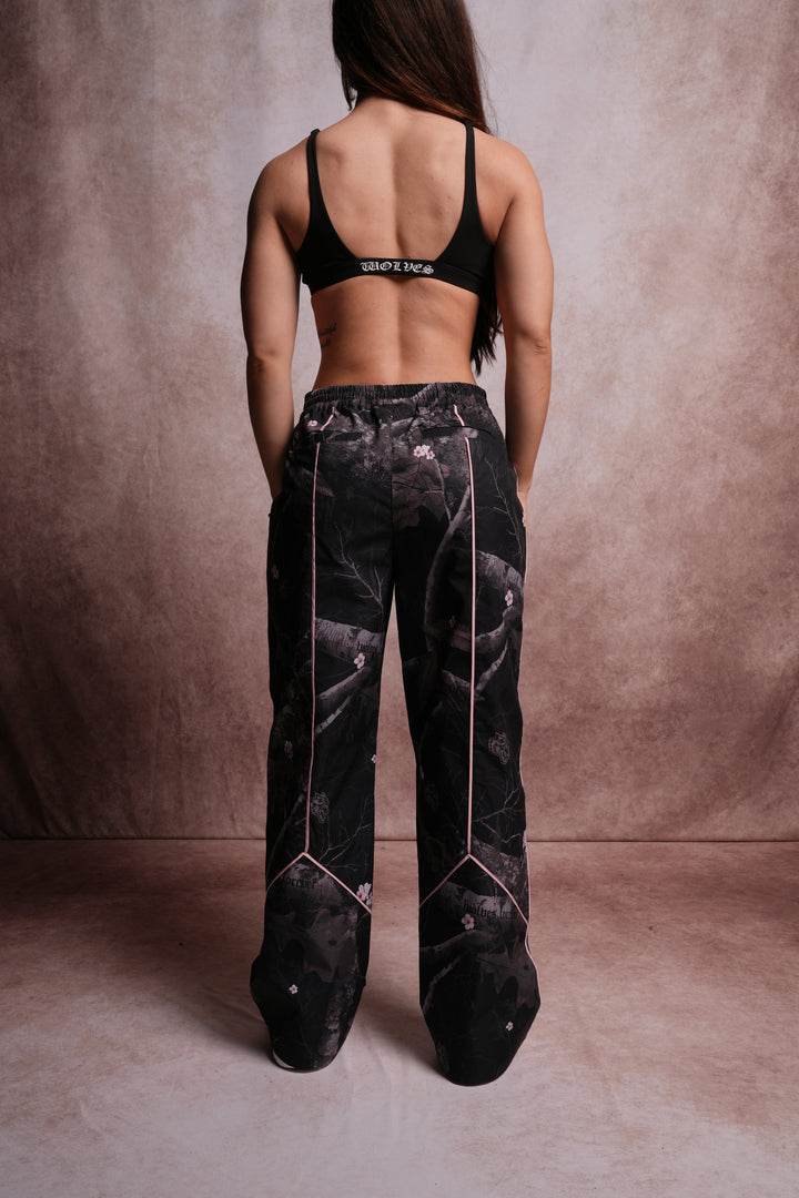 Dual Wolf Quinn Track Pants in Darc Blossom Woodland Camo/Cherry Blossom