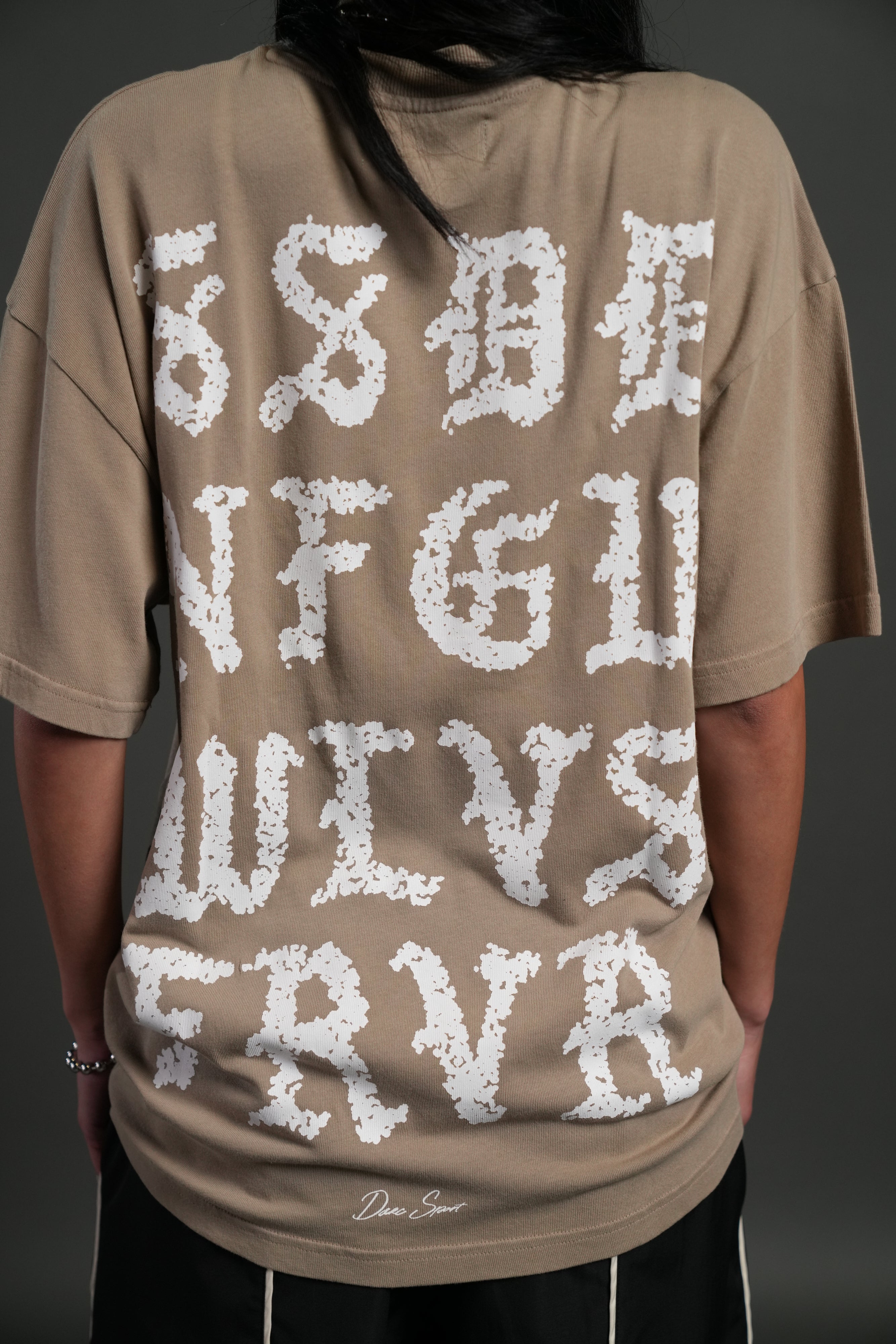 Stone Code "Pump Cover" Tee in Taupe