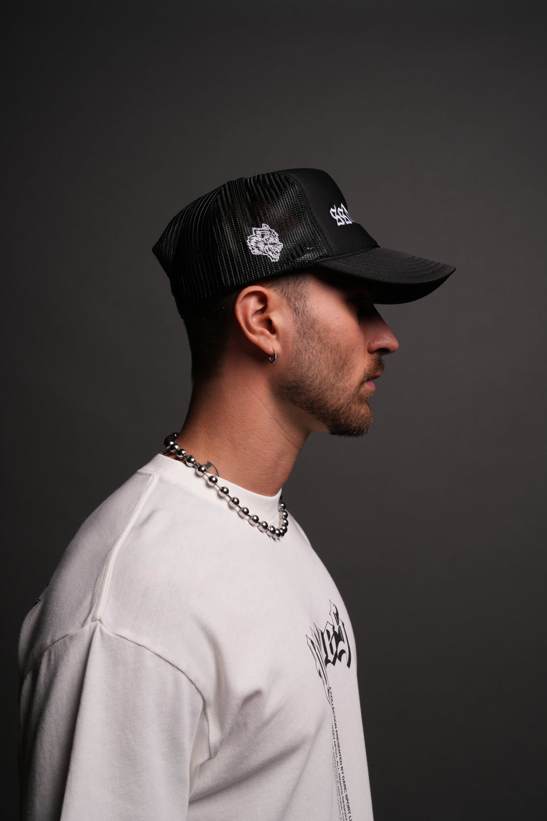 Our Mantra Trucker Hat in Black