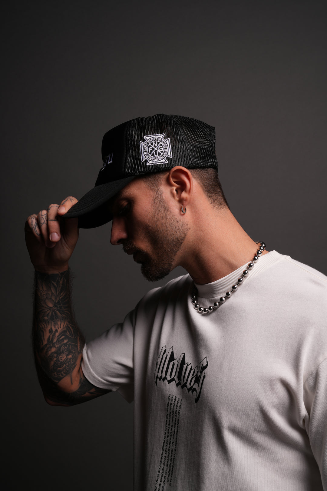 Our Mantra Trucker Hat in Black