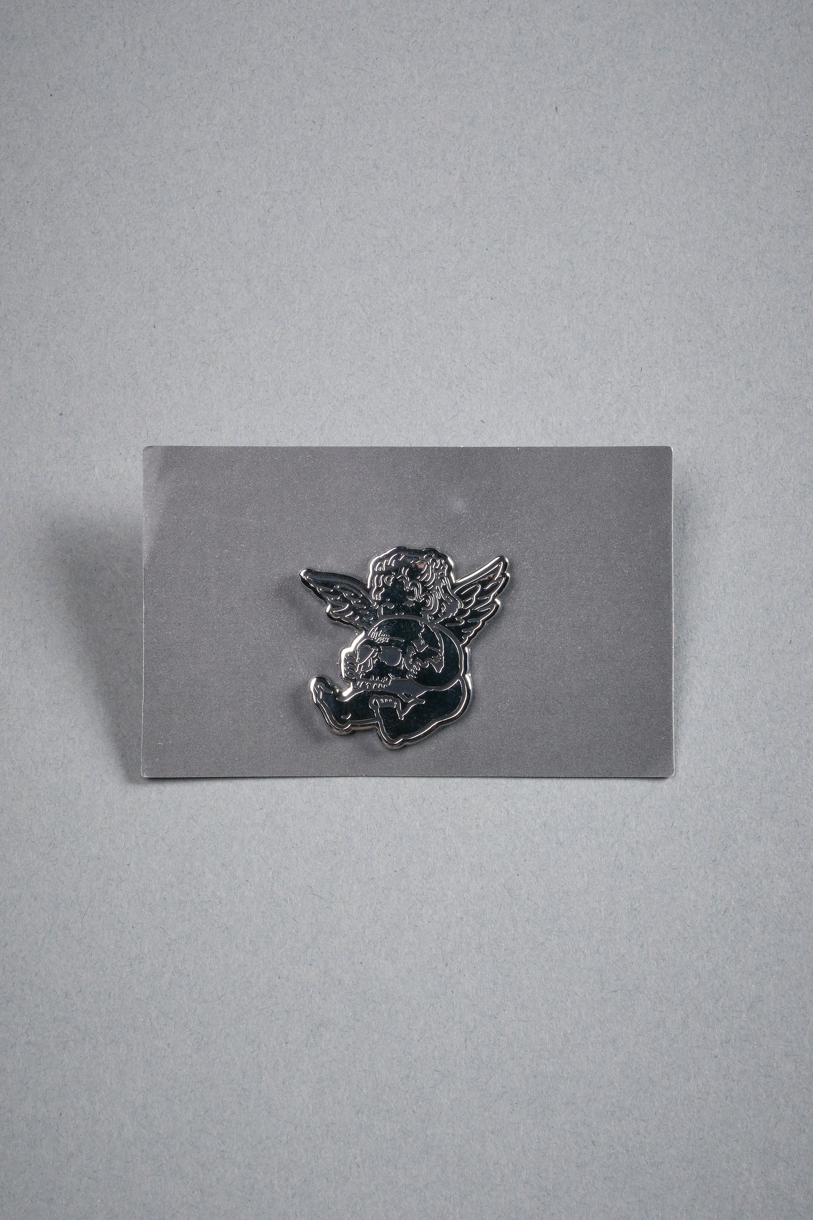 Darc Cherub Enamel Pin in Silver/Black