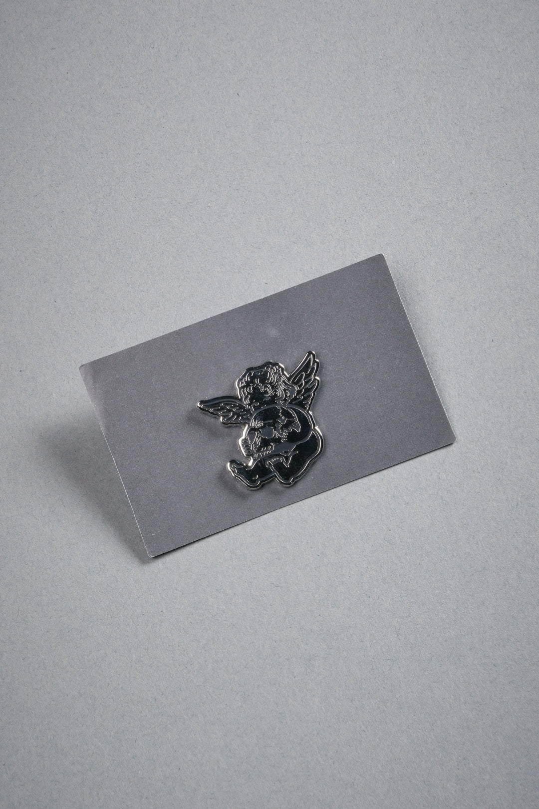 Darc Cherub Enamel Pin in Silver/Black