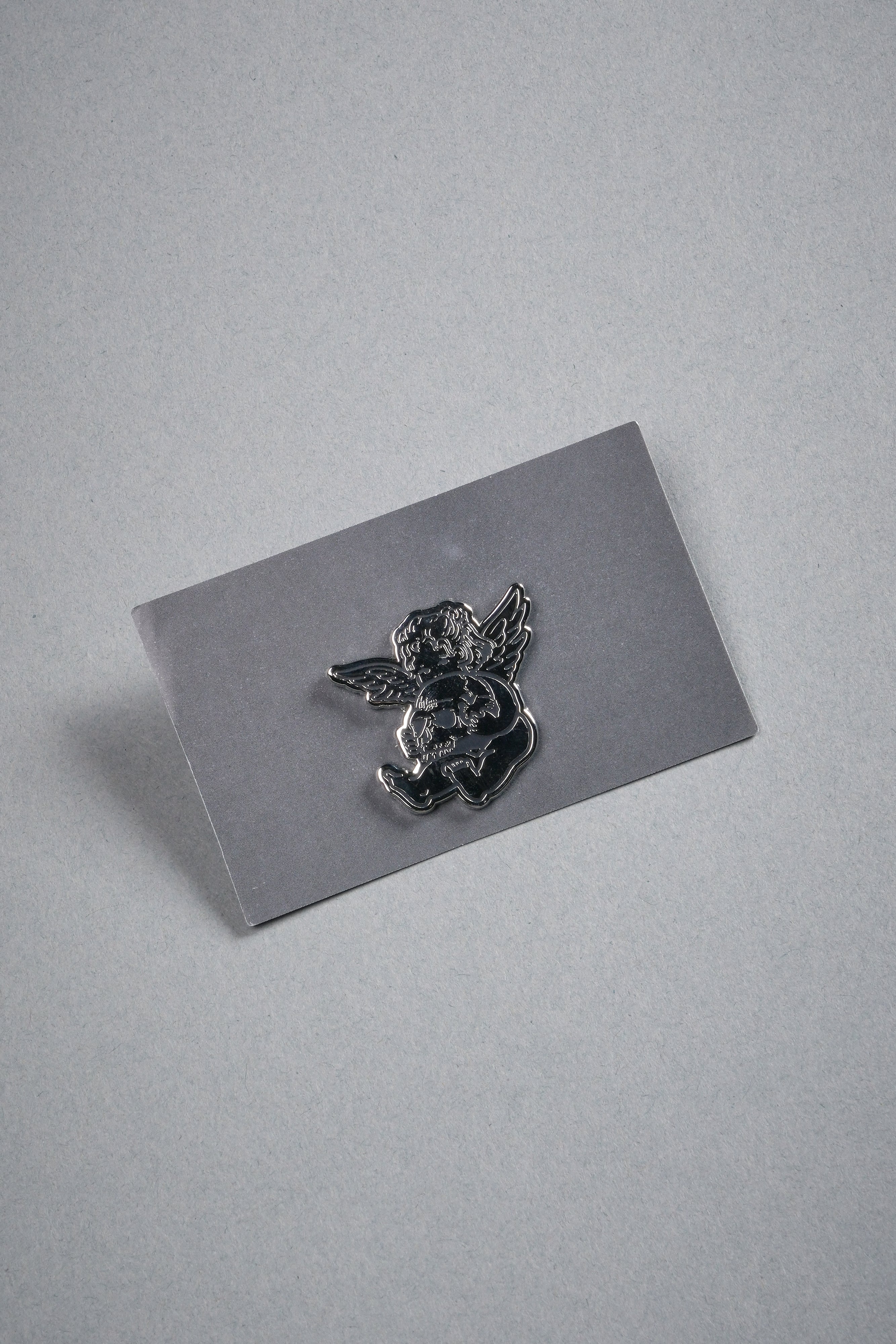Darc Cherub Enamel Pin in Silver/Black