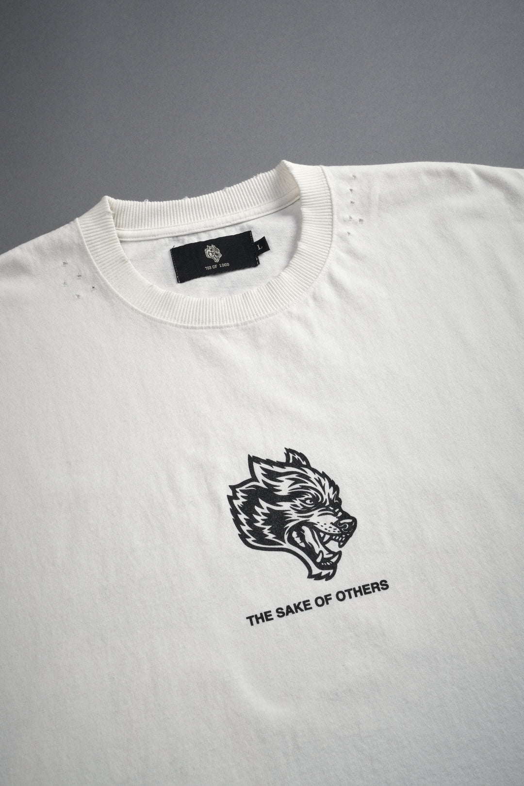 Holy Vow Distressed Grunge Cut-Off Mid-Length Raw Hem Tee in Cream