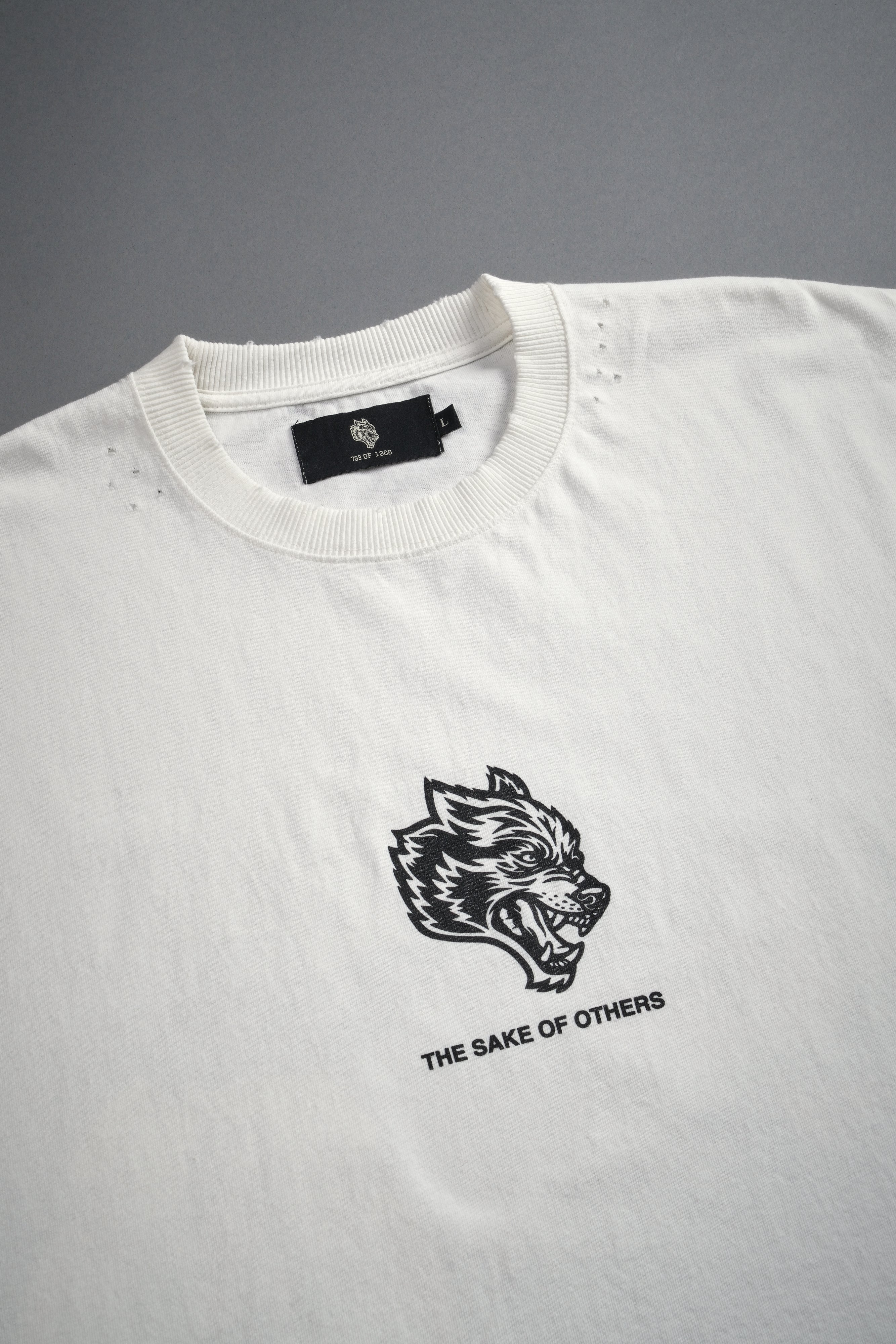 Holy Vow Distressed Grunge Cut-Off Mid-Length Raw Hem Tee in Cream