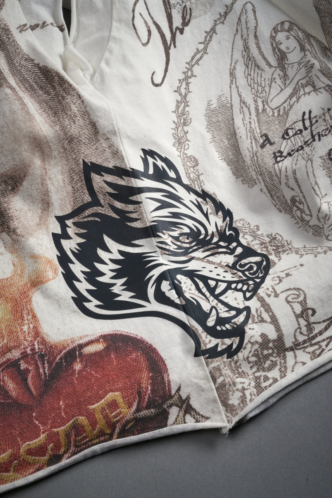 Heart of Thorns Distressed Grunge Cut-Off Mid-Length Raw Hem Tee in Cream