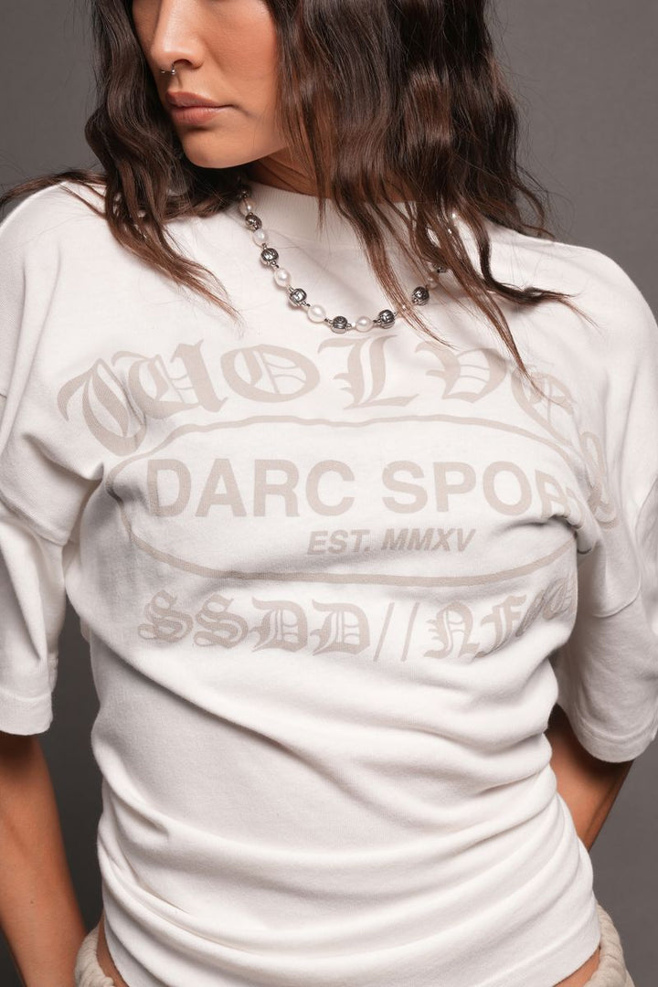 Darc Emblem Pump Cover In Cream